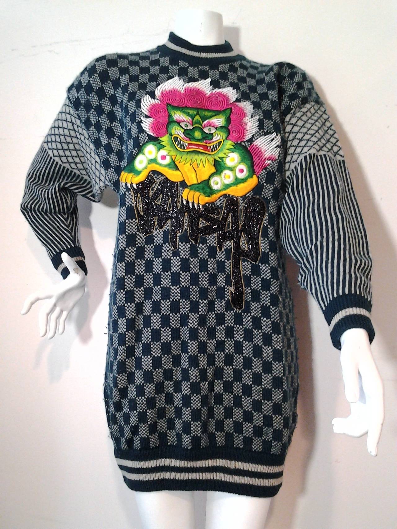 A fun 1980s Kansai Yamamoto multi-patterned sweater with beaded Kansai signature and embroidered dragon motif on front.