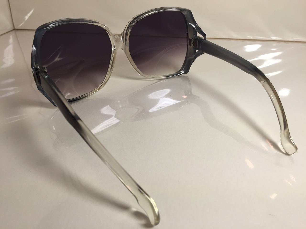 A fabulous pair of 1970s Yves Saint Laurent sunglasses with large lenses and frames in a chic blue gray tint.