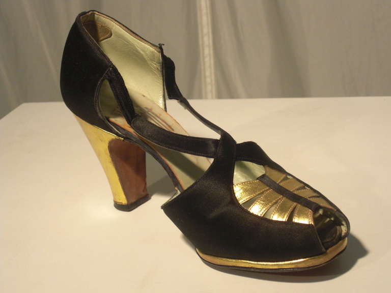 A gorgeous pair of 1930s Art Deco styled silk and gold gilt leather evening shoes by Debutante.  Great condition.