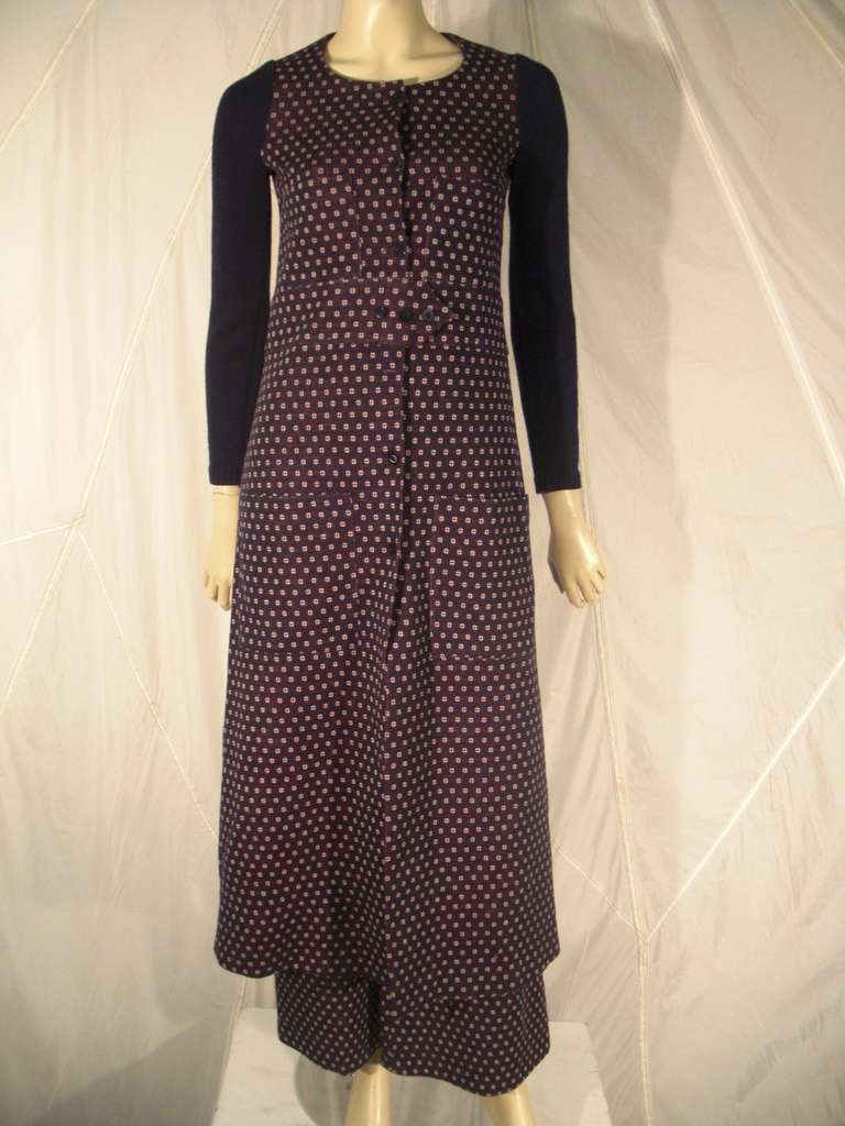 A wonderful 1960s Sonia Rykiel wool double-knit ensemble:  A maxi coat with front button closure and waistband.  Contrasting sleeves in Navy blue with red and white pin dot pattern.  Matching hip-hugger  flare-leg pants. Jacket is lined.
