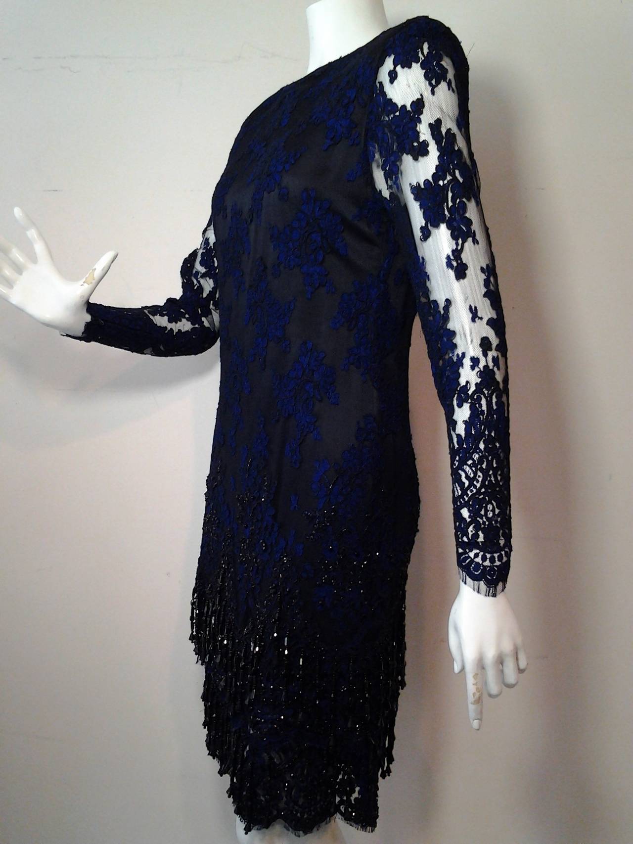 A gorgeous 1990 James Galanos cobalt and black Alencon lace shimmy dress: an inner slip layer with straps is heavily beaded and falls under the outer lace layer with 
