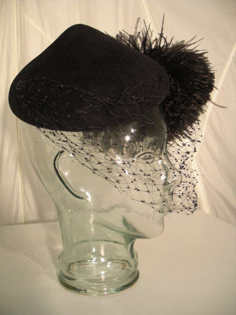 A gorgeous and dramatic 1950s Joseph's wool felt peaked hat with large black feather spray 