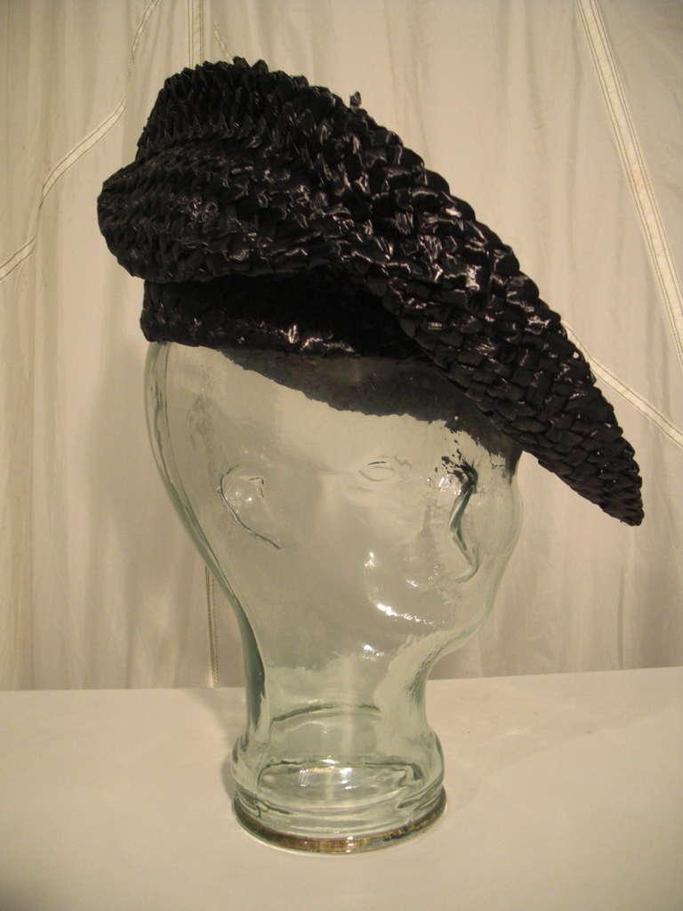 A super smart 1950s black straw Sally Victor tilt hat.