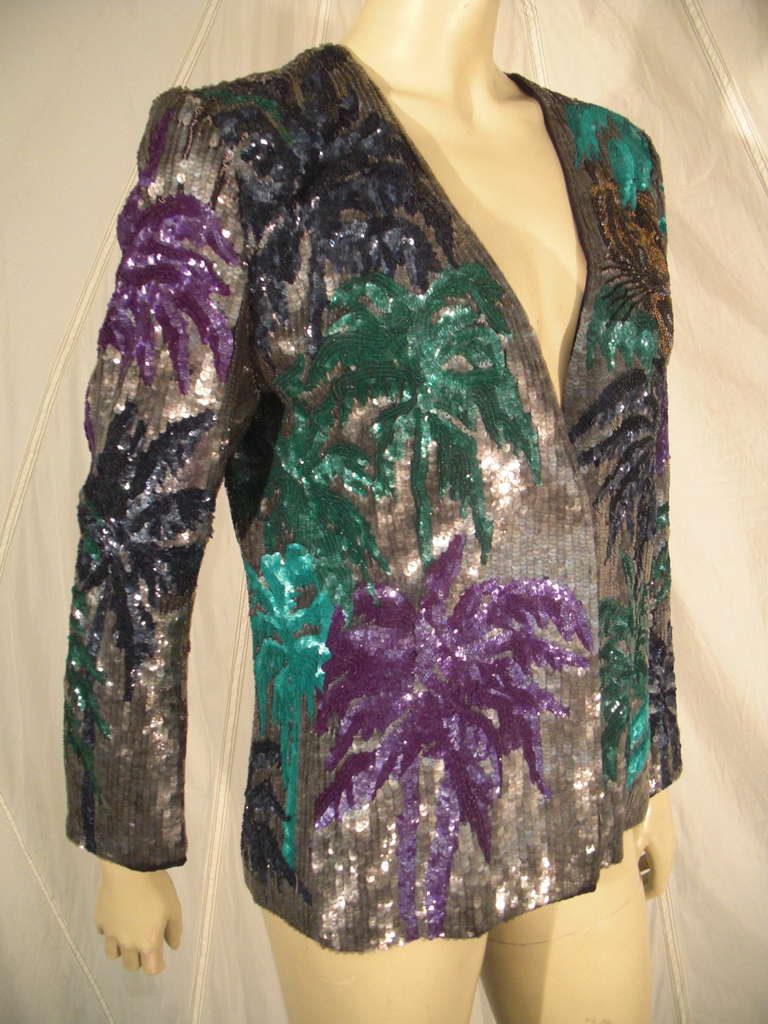 A gorgeous early 1980s Krizia blazer with palm branch and tiger motifs in sequins and seed beads.  Crepe jacket with acetate lining.  Front hidden button placket. Originally sold at Giorgio Beverly Hills.