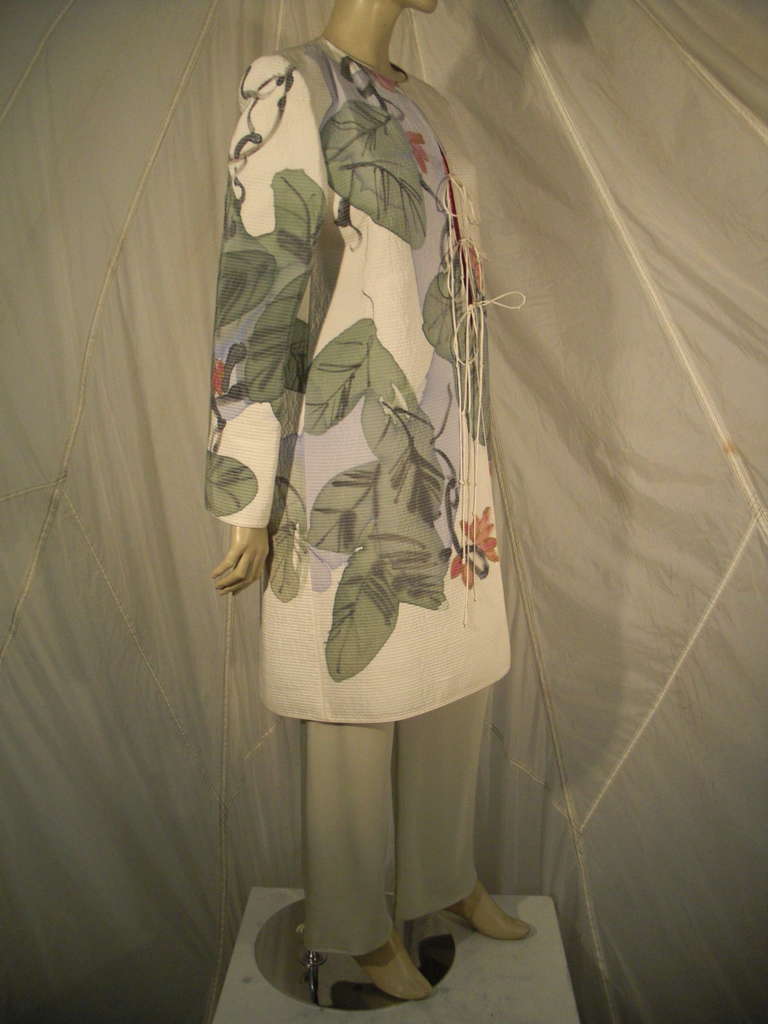 1990s Mary McFadden Couture quilted silk jacket, mid-length with string ties and hand-painted abstract floral and leaf pattern.  Coordinated silk pant in celadon, and boned coral silk bustier in signature gathered McFadden style.