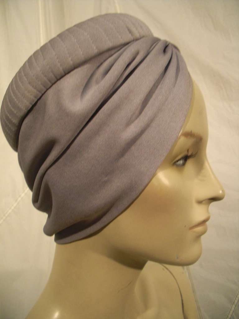 A fabulous 1950s dove grey silk jersey turban-style hat.  New-old stock, never worn.