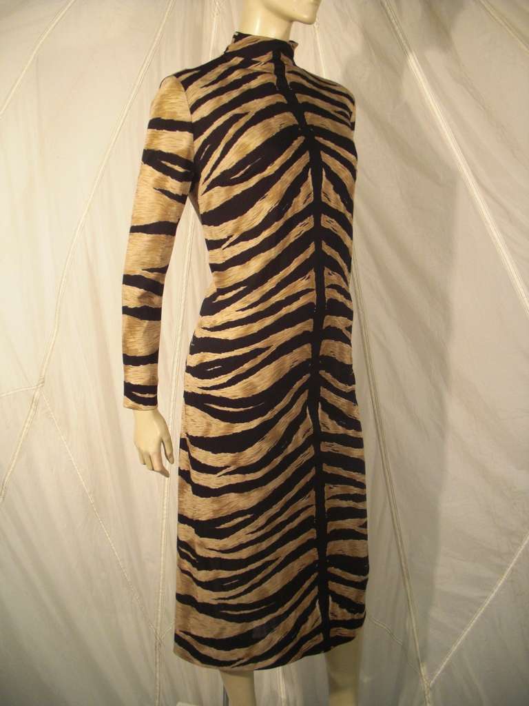 A fabulous 1970s long sleeved mock turtleneck silk jersey tiger print dress: Covered buttons on back. Matching .5