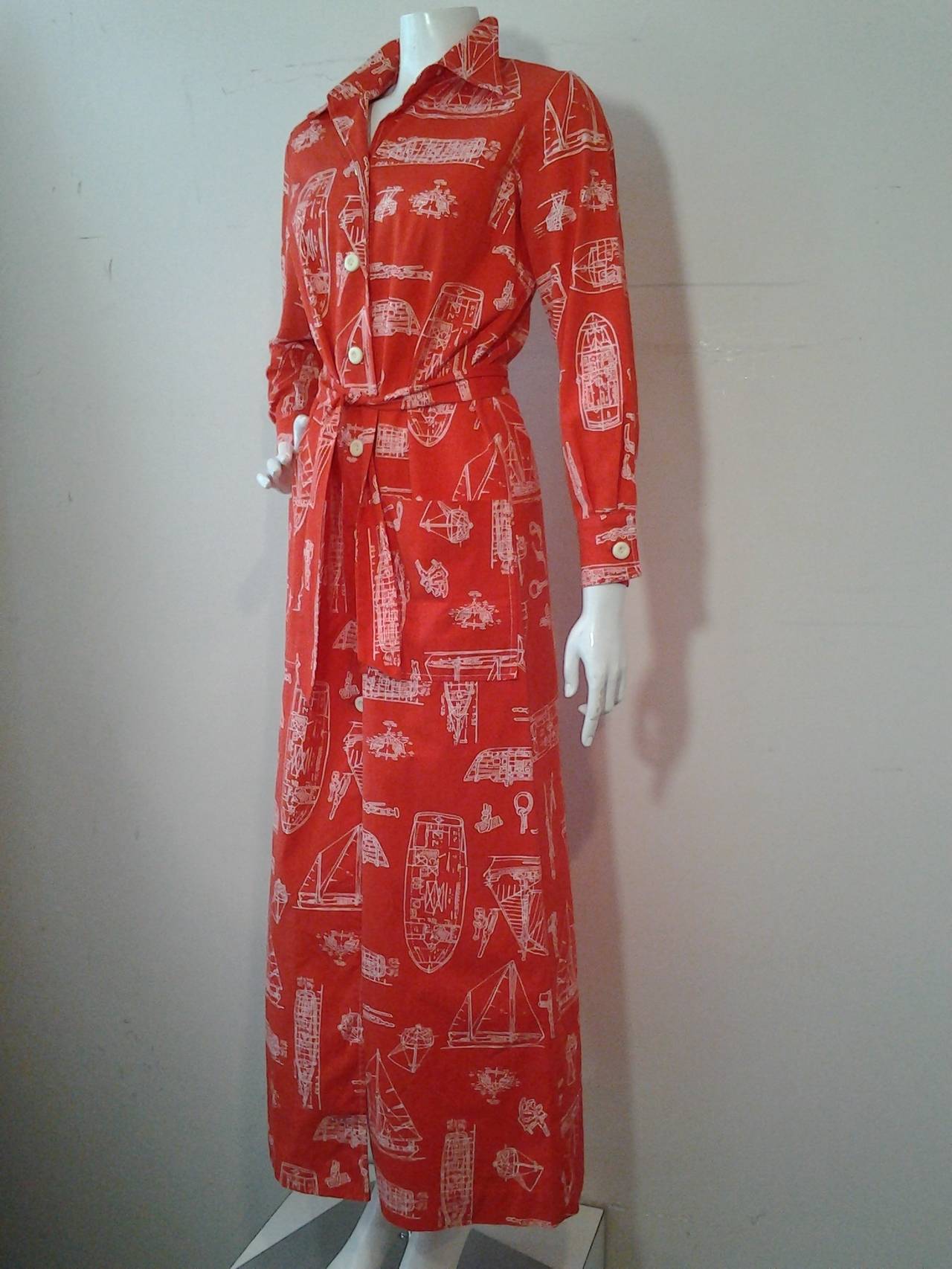 A fabulous 1960s cotton Tori Richard for I. Magnin Honolulu, Hawaii nautical print maxi dress in tomato red and white with button down front and matching belt.