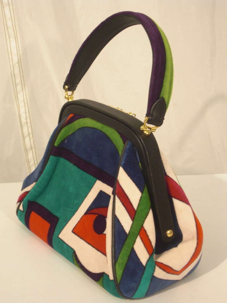 A wonderful 1960s Emilio Pucci leather framed cotton velveteen purse in bold pattern with gold hardware. Leather lined.