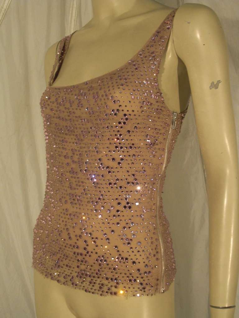 A glitzy Chaiken runway sample top with side zipper. Entire top is constructed of nude mesh topped with lavender Swarovski crystals. Chiffon lining.
