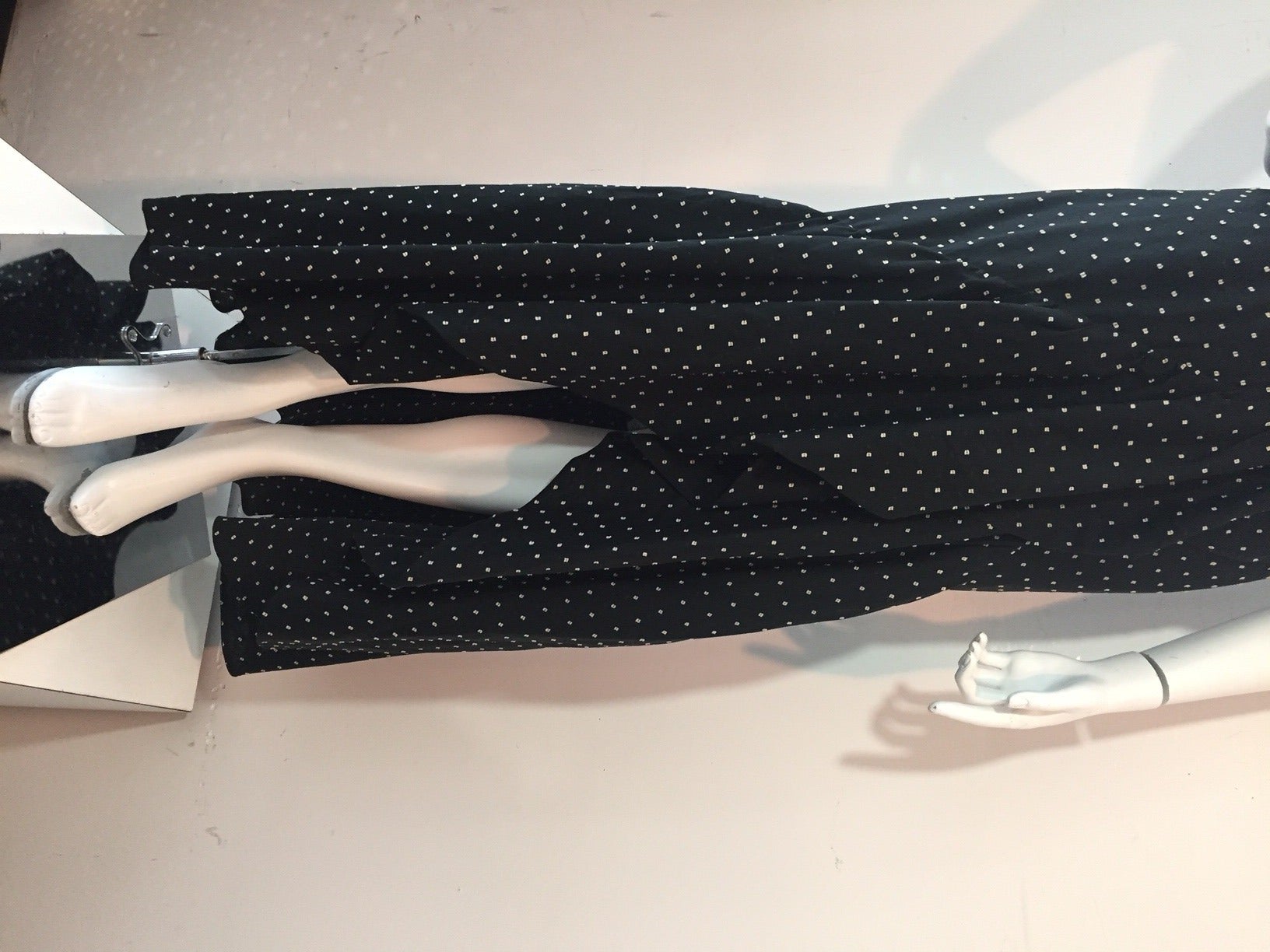 A fabulously sexy 1970s Halston ruffled hem and collar wrap gown in a summer-weight polka-dot black and white cotton with silk organza lining. Built in original bra. B-C cup with underwire.