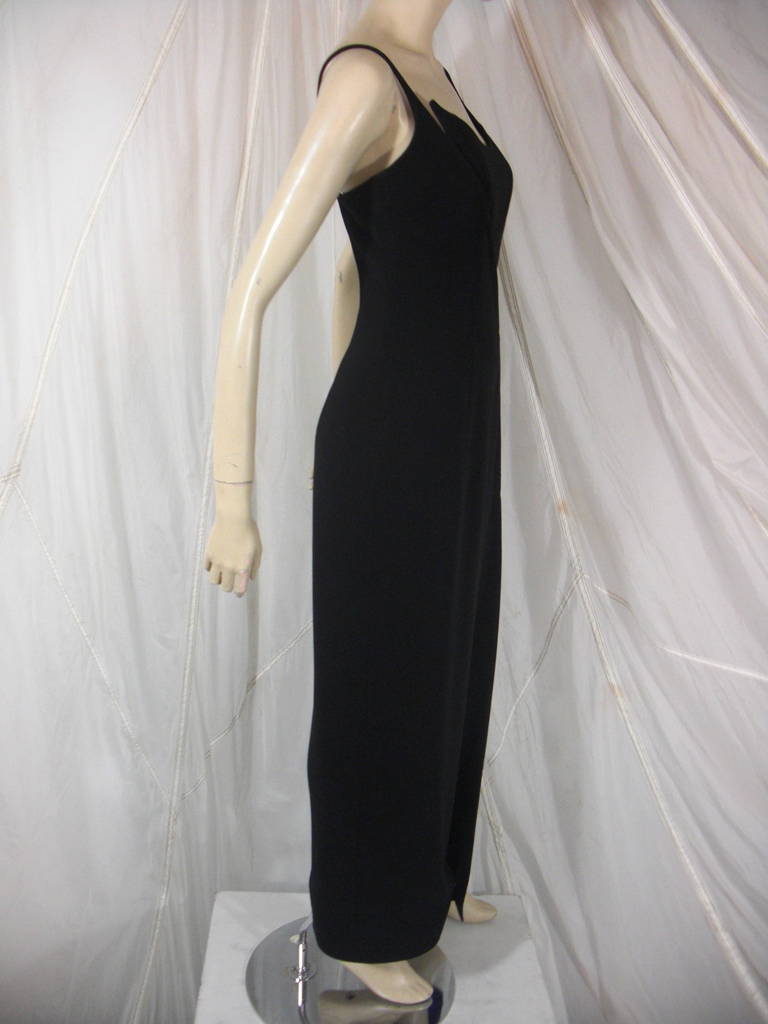 1980s Thierry Mugler Dramatic  Slit Evening Gown in Black Crepe with Electric Blue Satin Lining

Featuring Mugler signiture design with asymetrical neckline