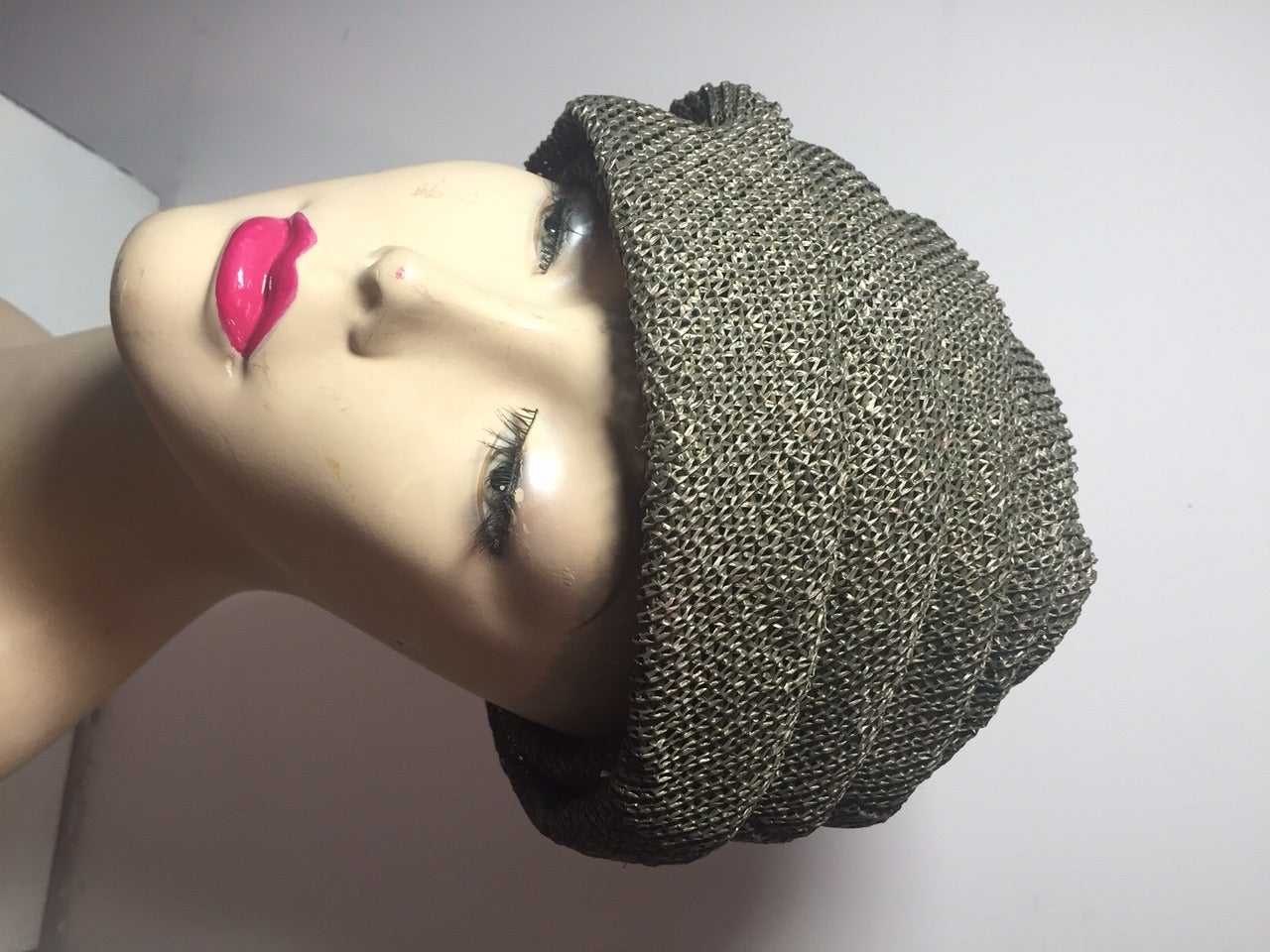 A lovely 1950s draped turban hat in olive woven buckram by Spanish couturier Pertegaz!  Lined in netting with grosgrain band.  