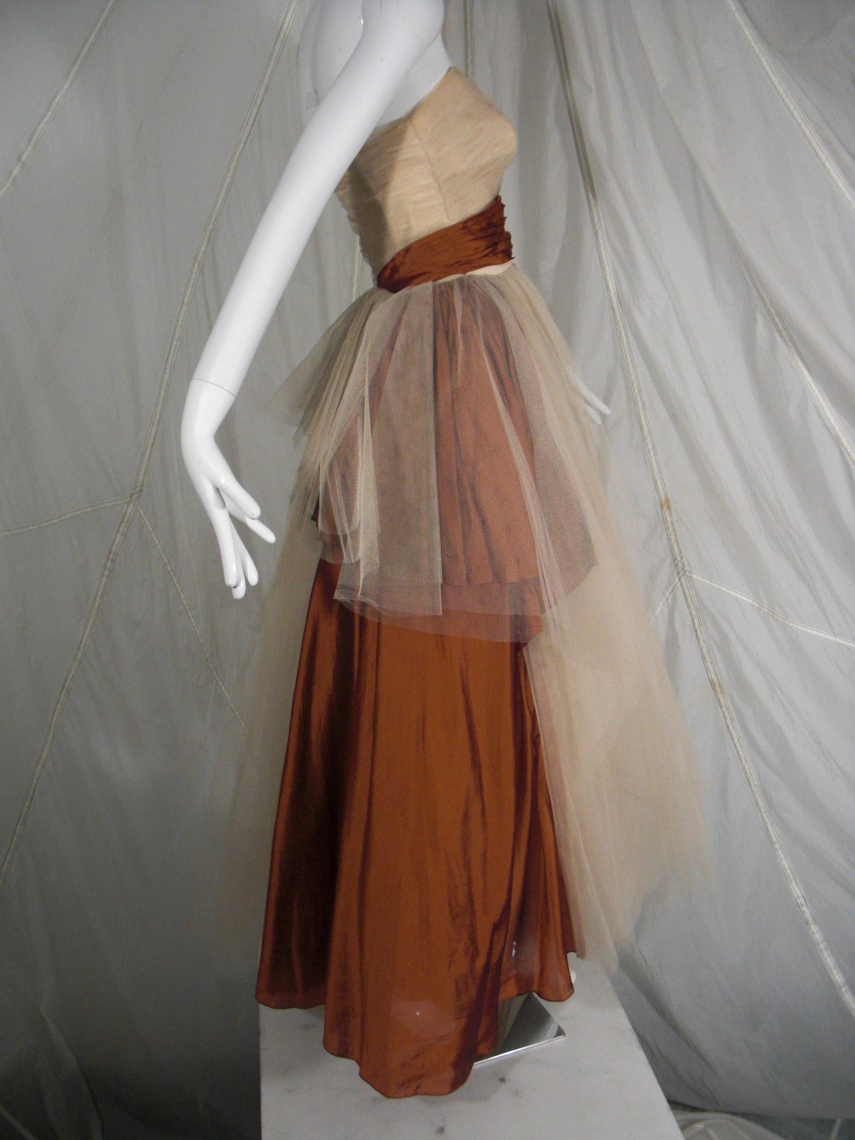 1950s Will Steinman Tulle and Silk Ball Gown

Stylized Bronze Silk Sash at Waist and Side

Boned Bodice and Fully Lined