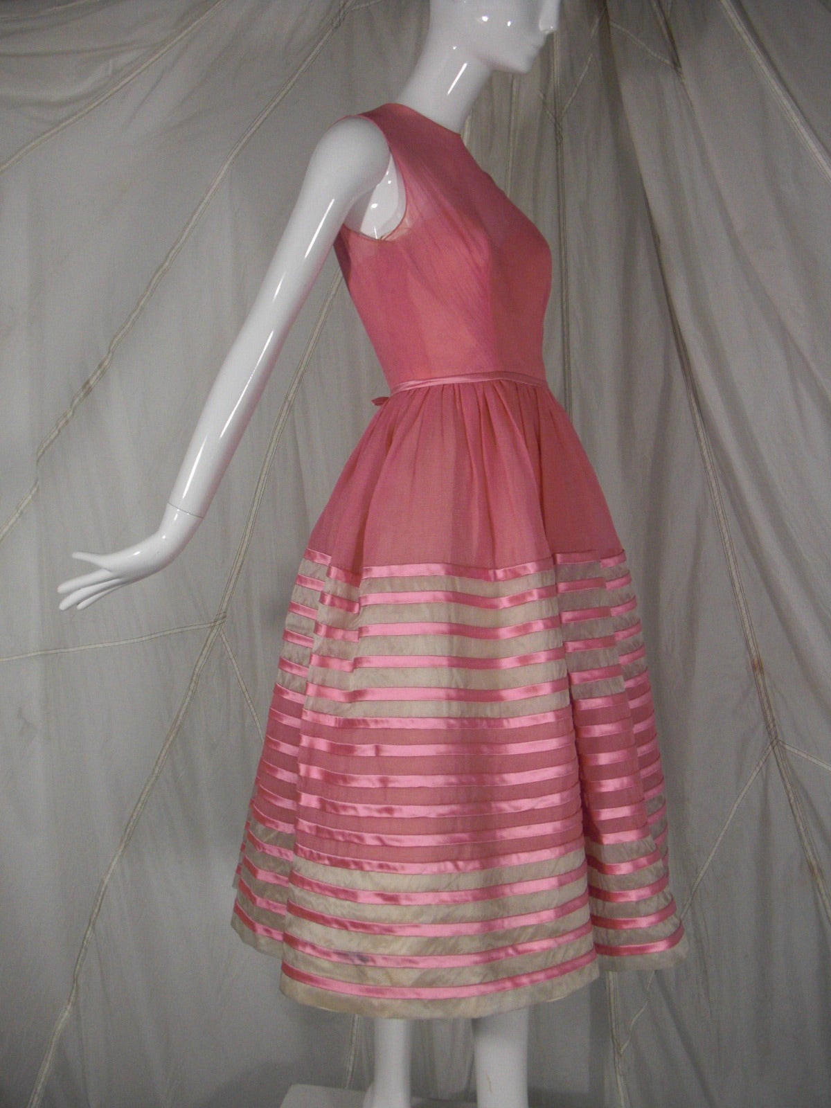 1960s Martha Pink Silk Organza over Tulle with Elaborate Silk Satin Ribbon

Fully boned bodice 

Original Underpinnings