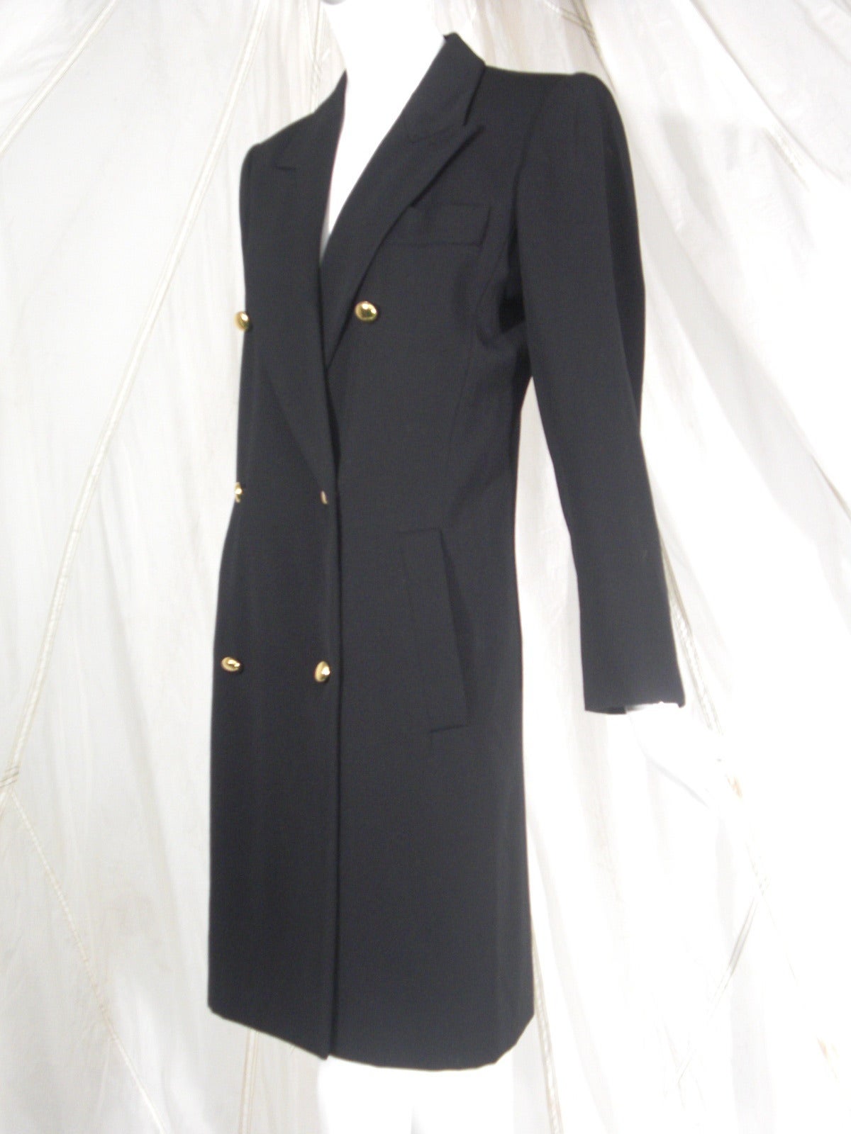 1980s Saint Laurent Rive Gauche Black Double Breasted Coat

Slim Silhouette with Strong Shoulder

Classic Brass Buttons