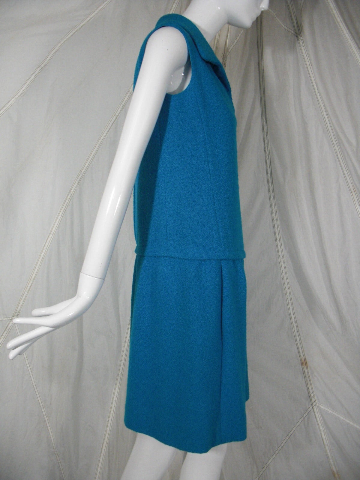 A sporty 1960s B. H. Wragge turquoise summer-weight wool dress with collar, drop-waist and 2 front slash pockets.  Fully lined.