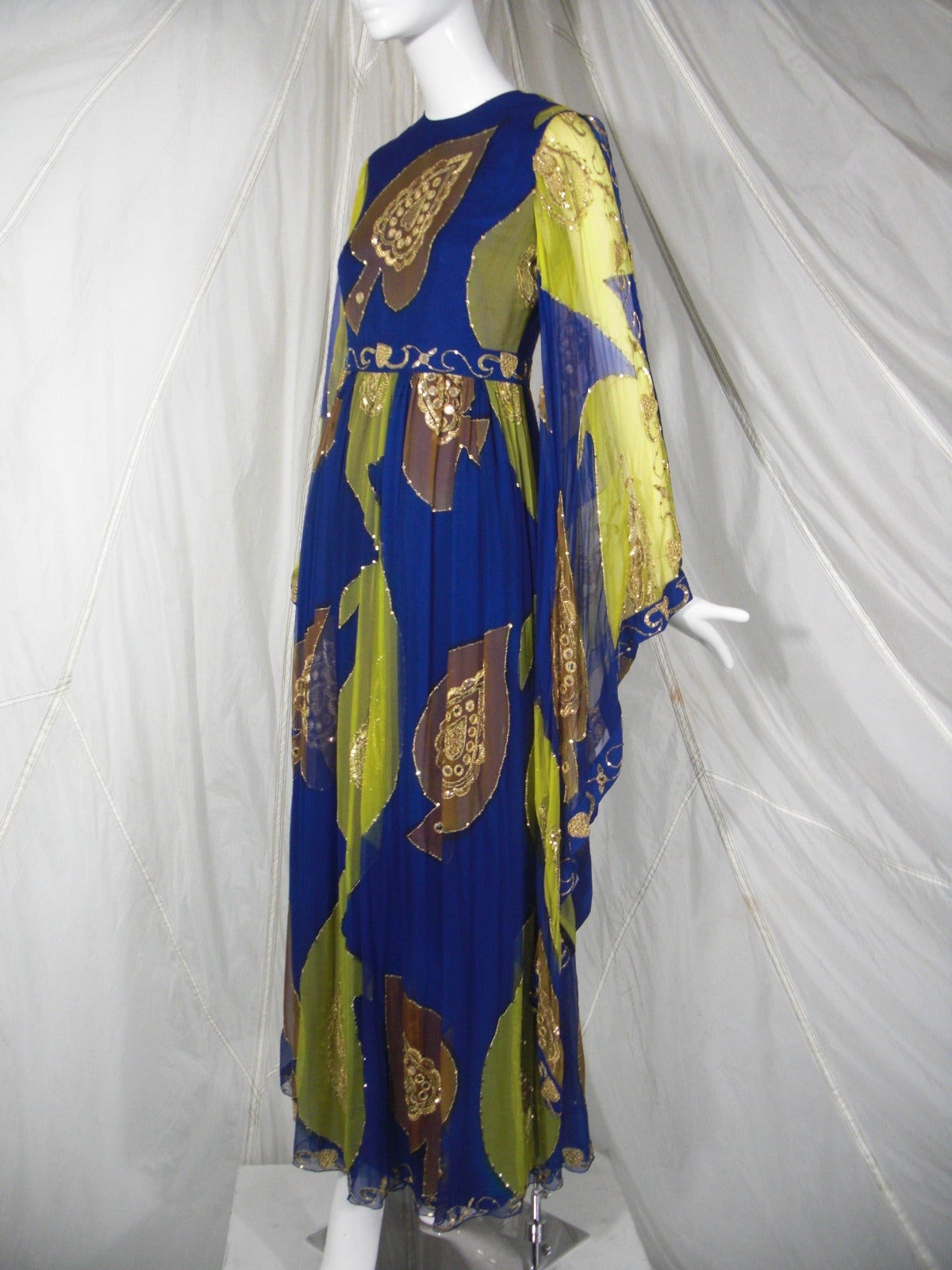 A beautiful 1960s Nan Duskin silk chiffon, sequined, sari-inspired gown with full sleeves and sheer overlay and lining.