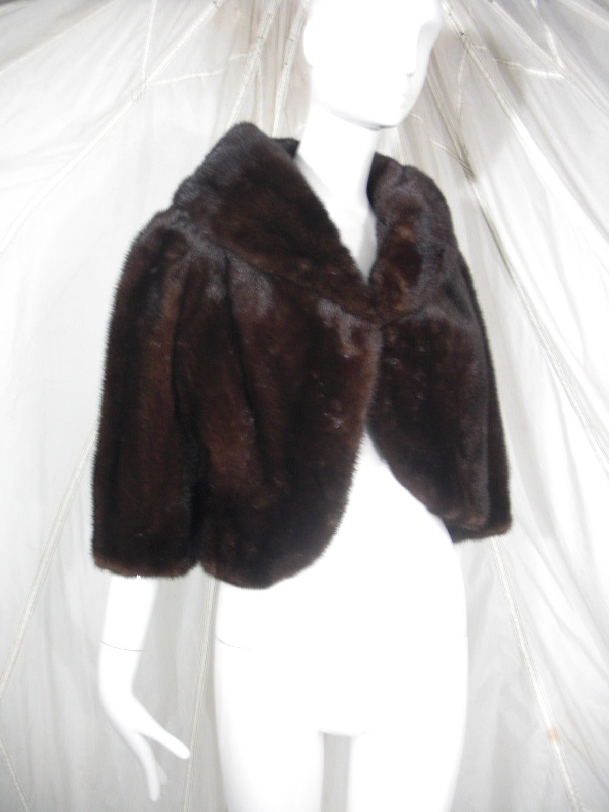 A luxurious 1960s I. Magnin chocolate brown mink evening jacket:  Cropped with lush collar and 3/4 length sleeves. Fully silk lined.