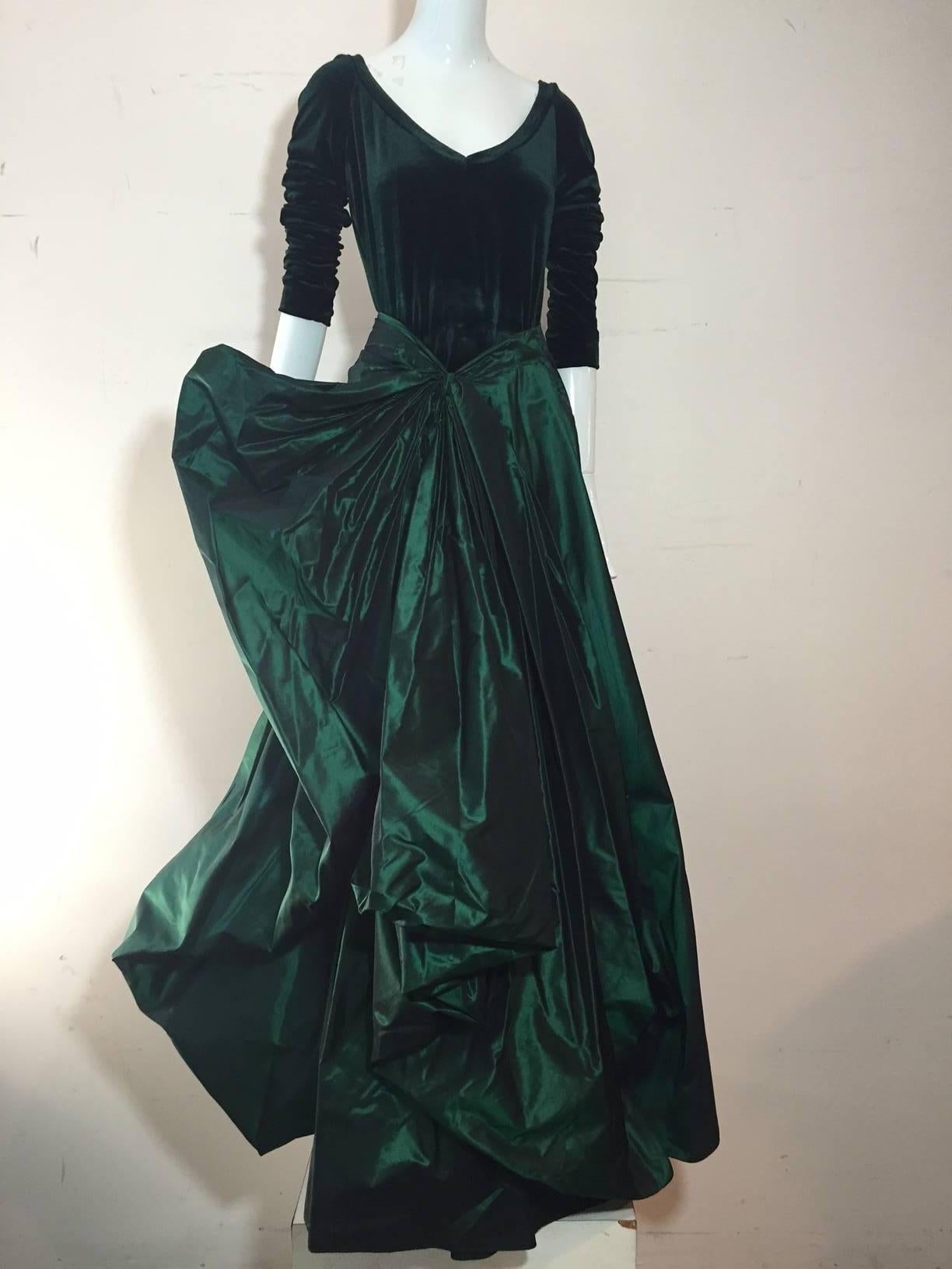 A lovely 1990s Gianfranco Ferre forest green silk taffeta and stretch velvet gown:  bodice is complete body suit with low scoop neckline and snap closure. Skirt is heavily gathered and constructed into a full side pouf ball gown. 