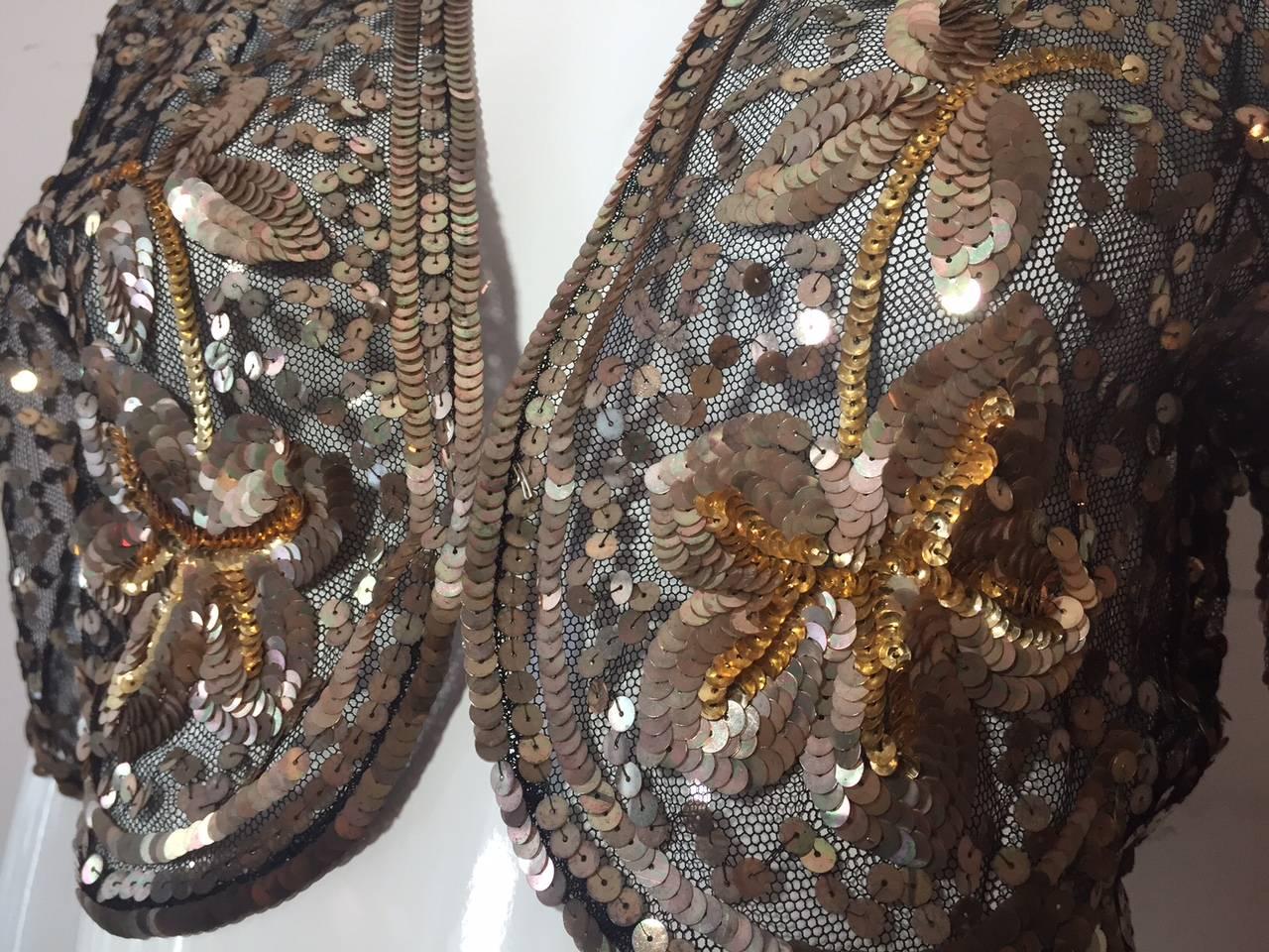 A fabulous little 1930s black silk tulle bolero jacket embroidered in gold sequins!  Beautiful pattern!  Scalloped hem. Made in France.  No closure.  Could attach one. 