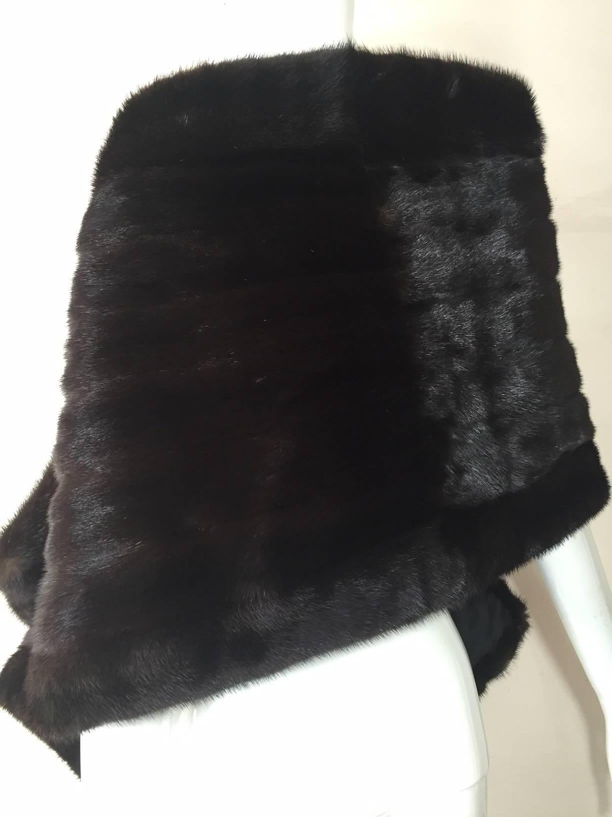 A gorgeous 1970s BlackGlama mink wrap:  flat rectangular, unstructured style, lined in silk.

69