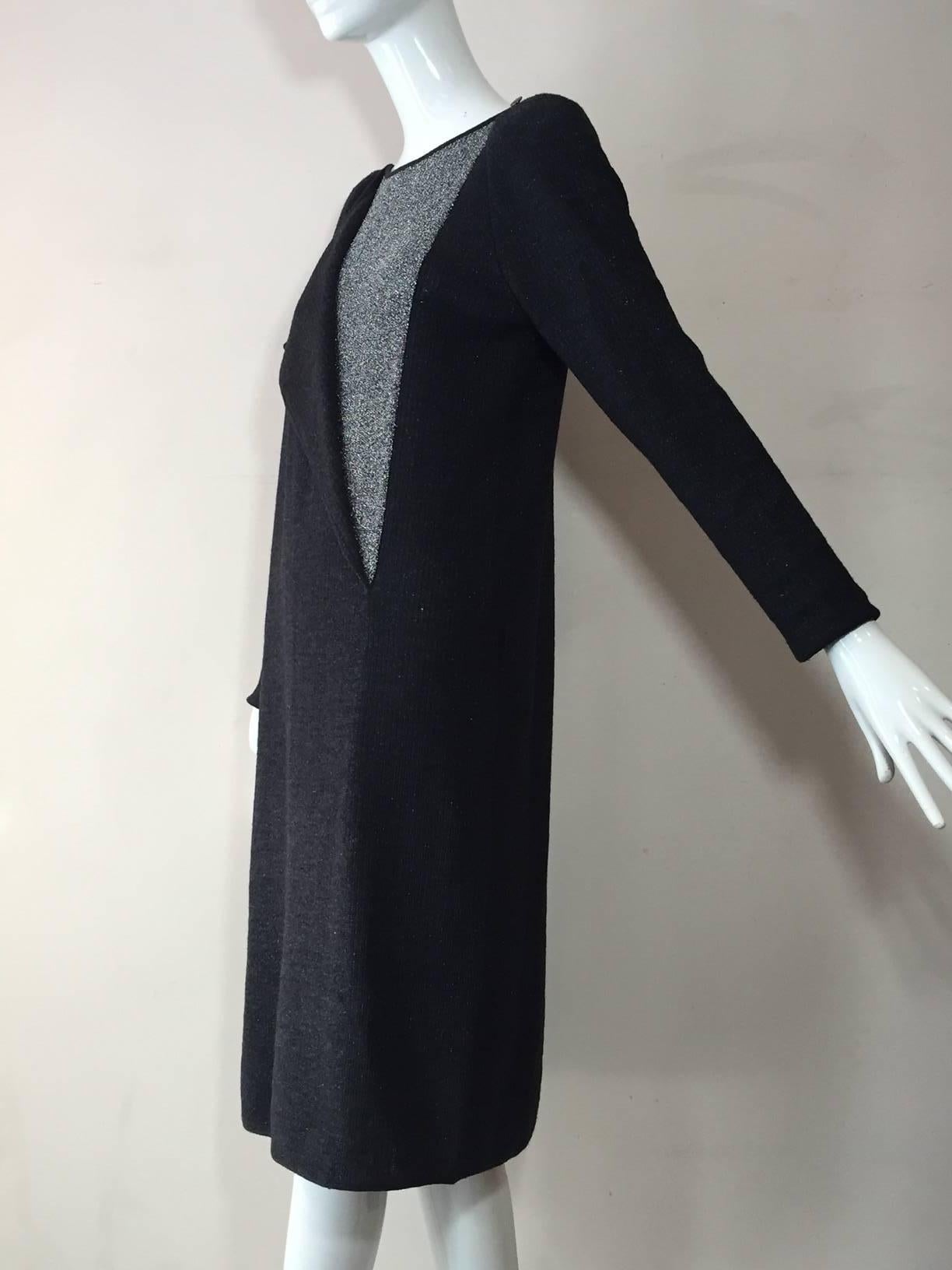 A 1980s Karl Lagerfeld for Chloe gray wool and lurex knit dress:  long sleeves, padded shoulders.  Front panel unbuttons to reveal silver lurex panel. Side slit is backed with lurex for peek-a-boo effect. 