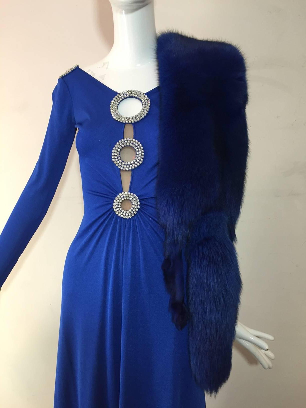 An over-the-top 1970s cobalt blue fox stole with feet and face intact.  Fox face is covered in a rhinestone 