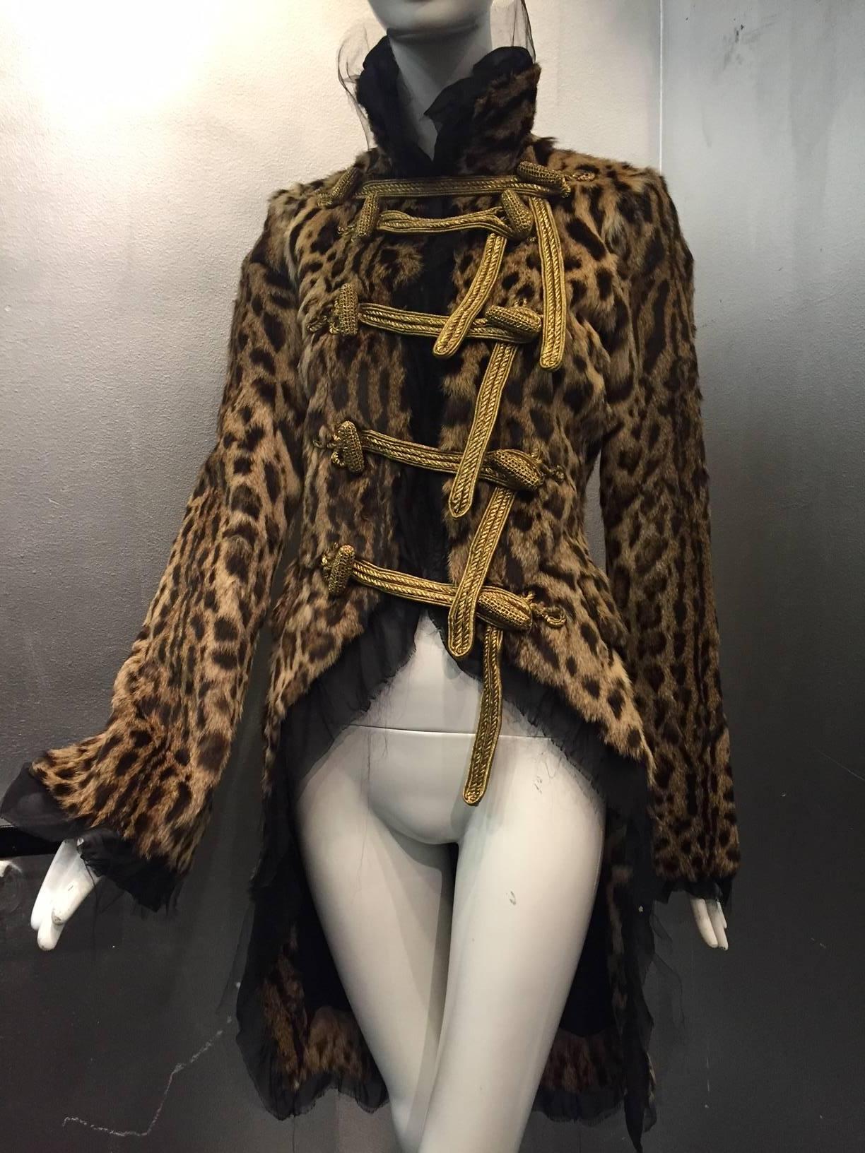 An incredible, one of a kind couture Roberto Cavalli Geoffrey Cat tailcoat: Napoleonic military-inspired shape with raw-edged silk tulle and chiffon trim and lining.  Extravagant gold bullion style functional frog closures. Deep slit cuff openings. 