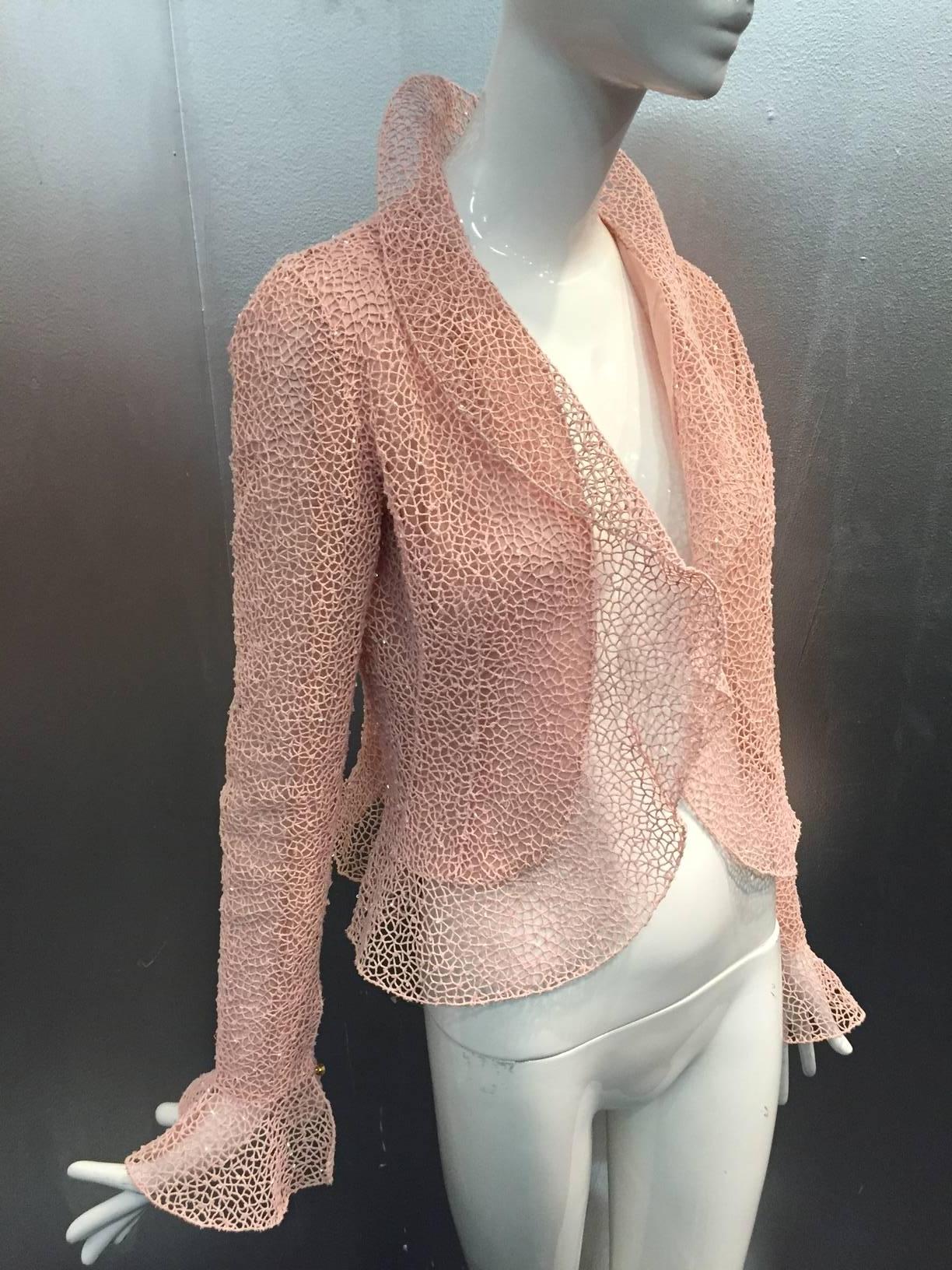 Oscar de La Renta pink mesh lace cropped jacket with ruffled hem, collar and cuffs. Rhinestone button at cuffs. Lined in silk chiffon and single snap closure. 