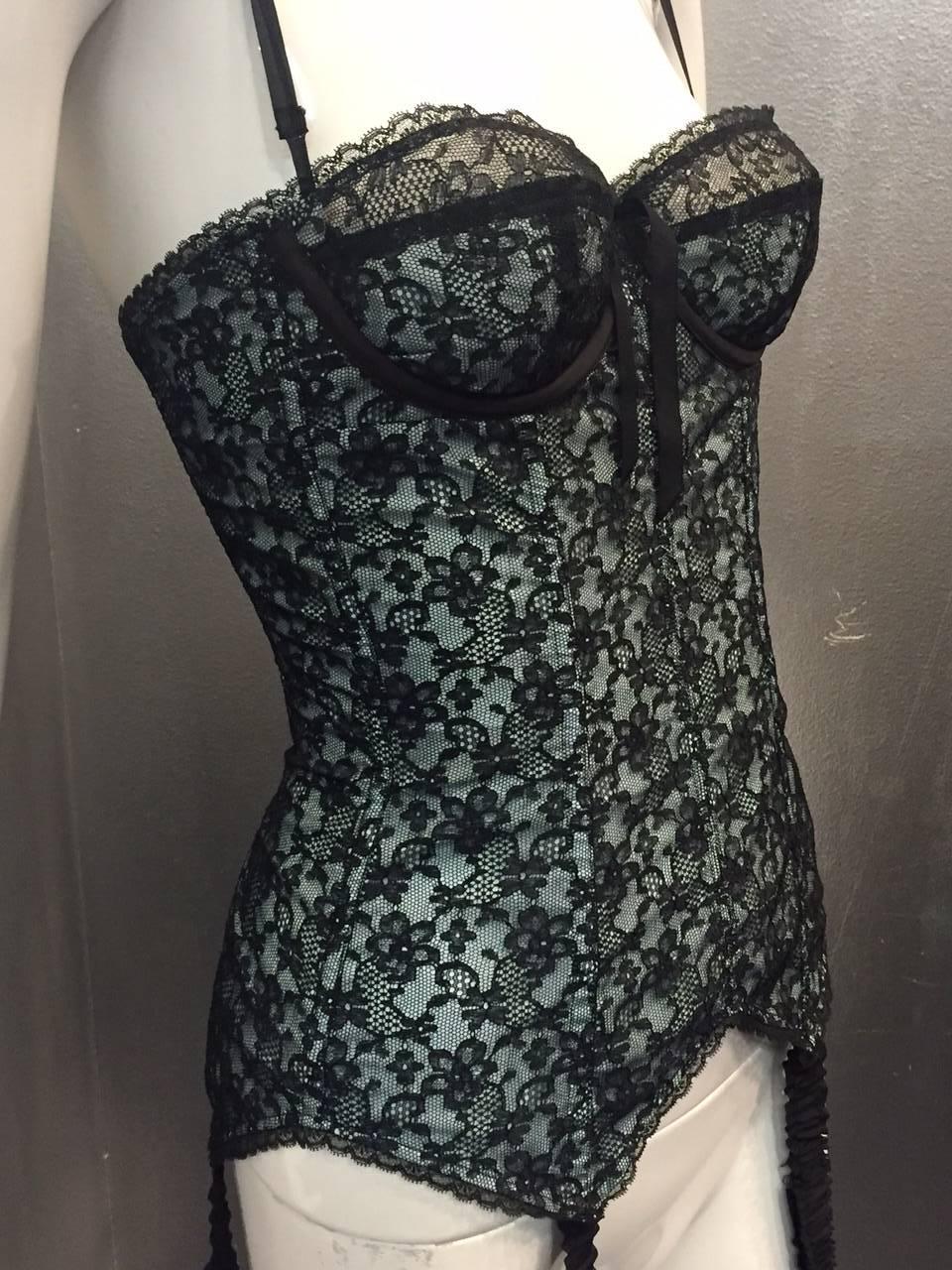 A fabulous, sexy 1950s black and pale blue lace Merry Widow with shoulder straps and attached garters.  Made in France. 