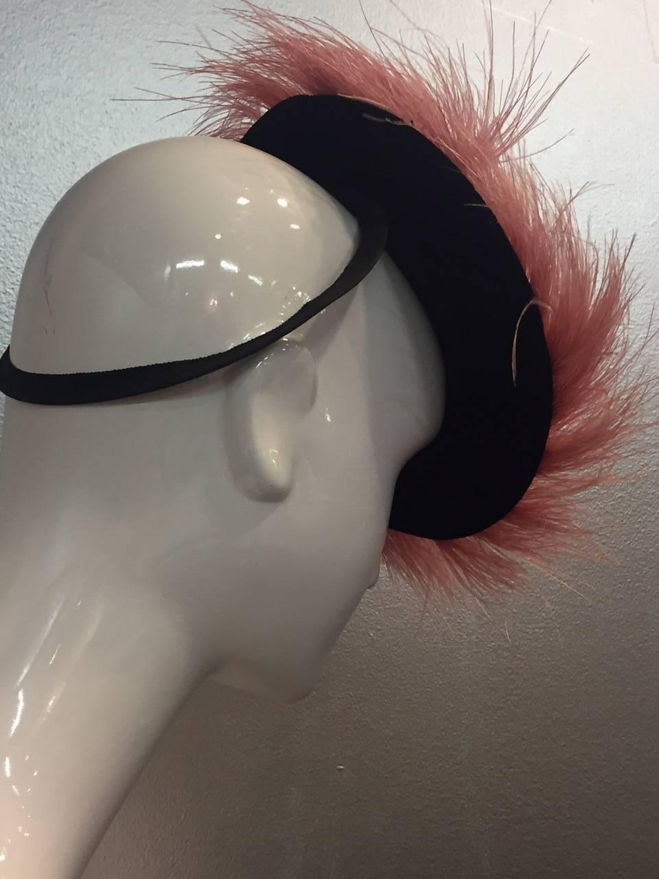 A gorgeous 1940s New York Creations black velvet tilt hat trimmed with rings of gorgeous soft pink egret feathers! Wire back ring.  