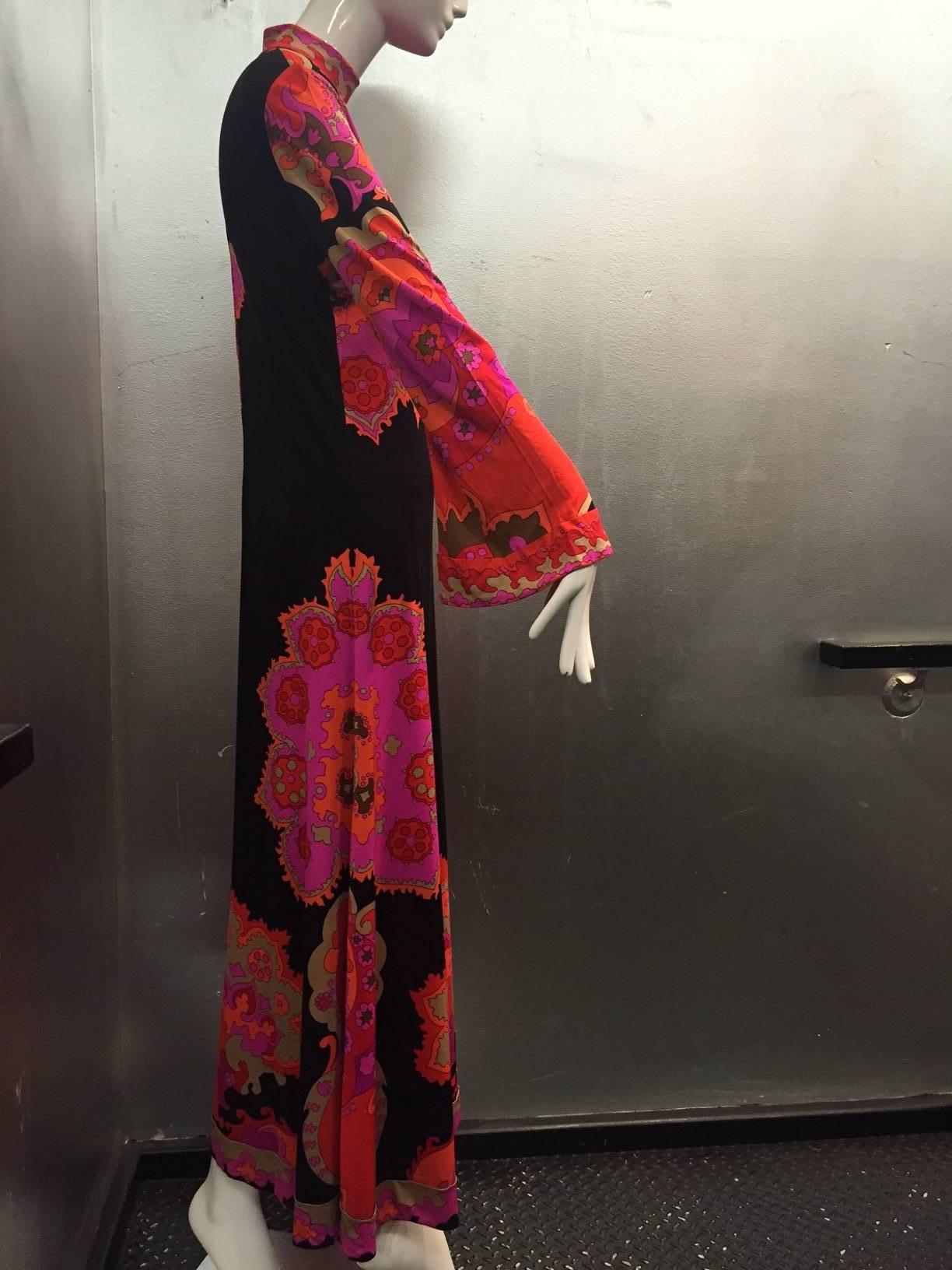 A gorgeous 1970s Leonard silk jersey psychedelic print maxi dress: Fuchsia, tan, orange, red and black make for a striking palette! Zippered back.