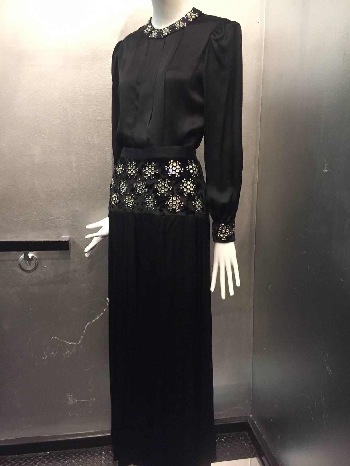 A fabulous 1970s Adolfo 2-piece ensemble:  Pleated-leg culottes with a velvet and rhinestone embellished dropped waist panel.  Matching silk satin blouse with rhinestone trim. 