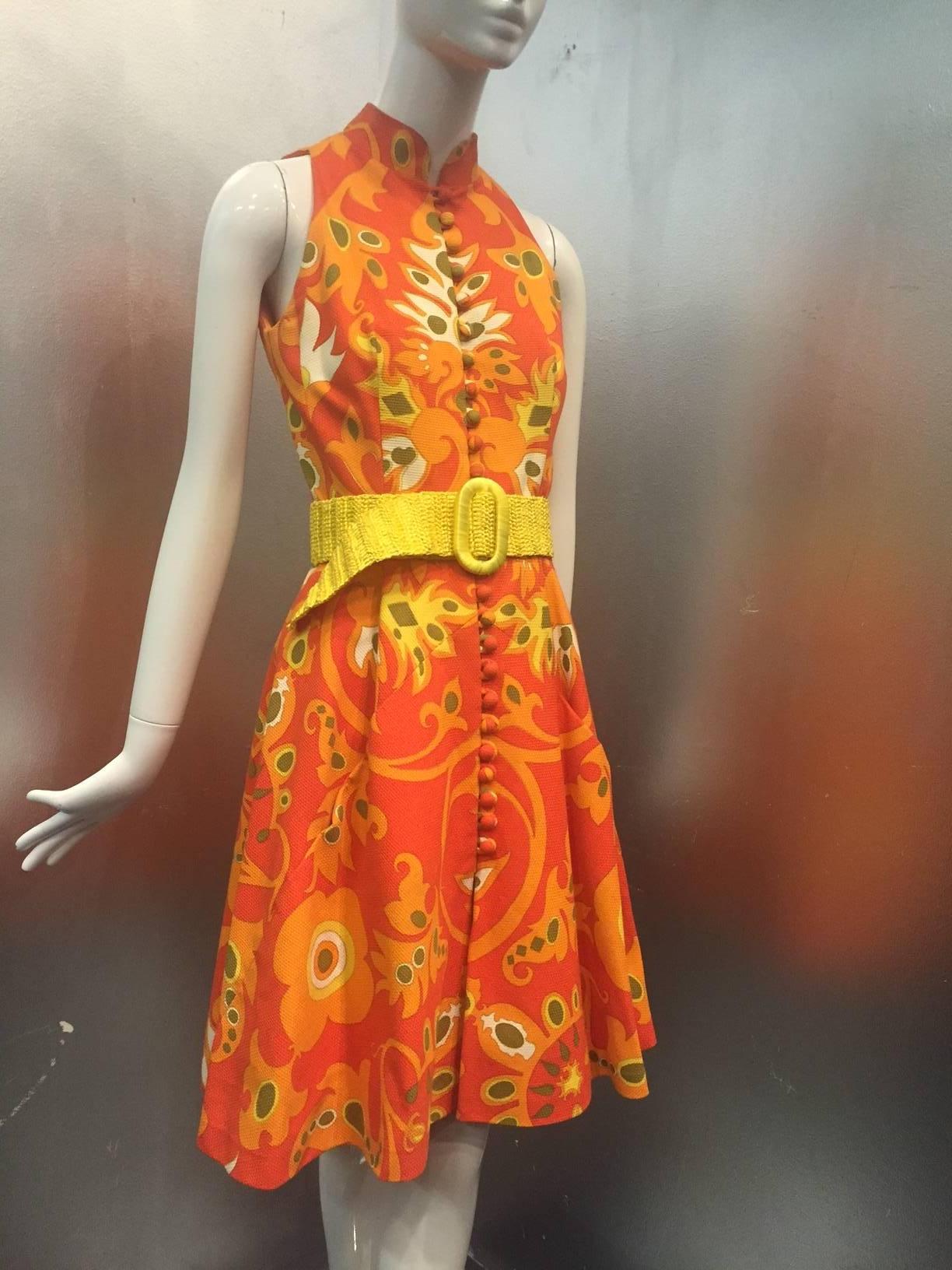 1960s Geoffrey Beene cotton piqué mod mini dress.  Floral Paisley pop-art print. Fitted sleeveless bodice with button and loop closures at front.  Mandarin Collar.  Flared A-Line skirt with pockets built into clever seaming at front.  