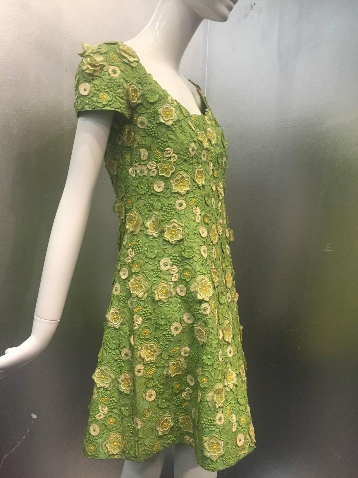A fantastic 1960s Arnold Scaasi apple green silk appliqué lace mini dress and bolero jacket ensemble.  Completely lined in silk. Skirt hem is constructed with horsehair for volume. Back zipper. 