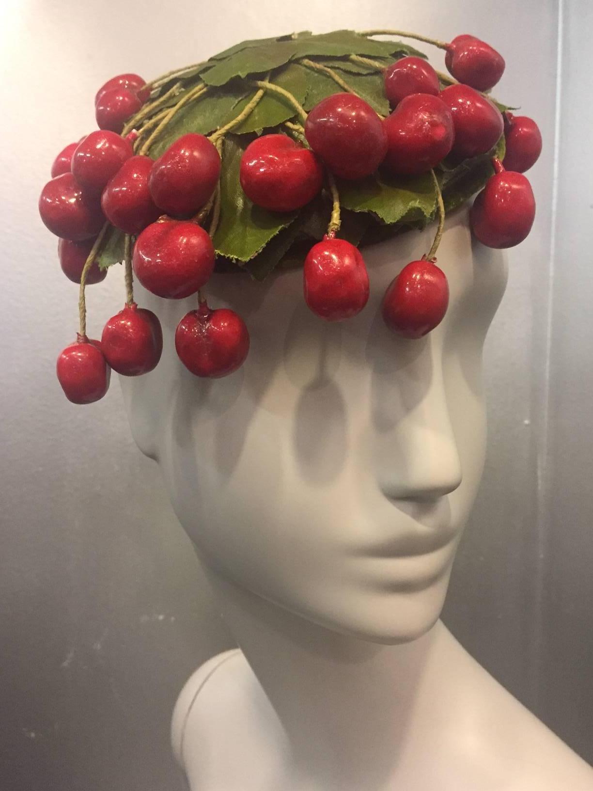 1950s Arthur Rubin custom made straw hat completely covered in realistic artificial glossy bing cherries!!  Lined in lace with combs inside for secure wearing. 