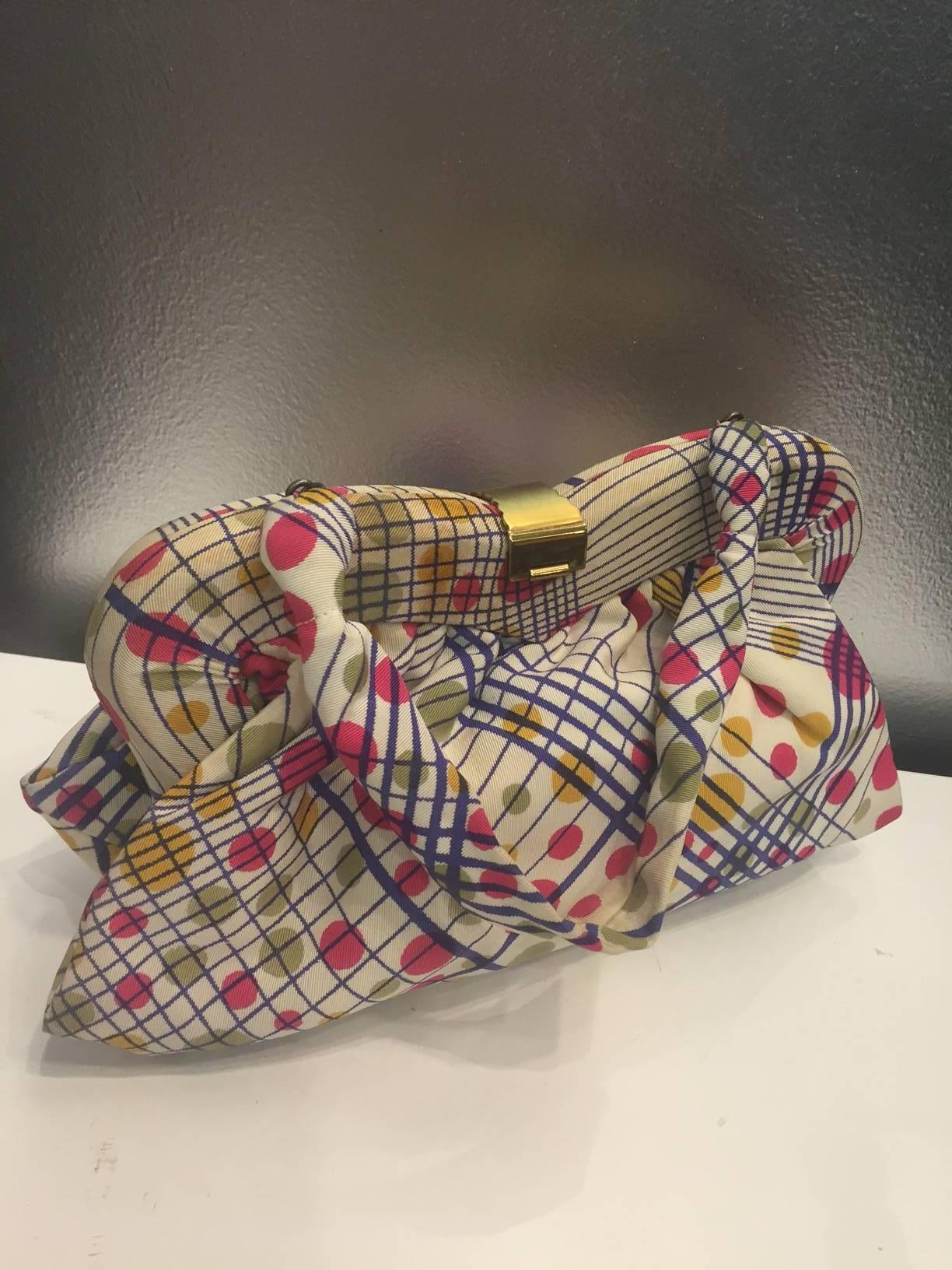 A gorgeous 1940  whimsical polka-dot and plaid faille framed purse with gold tone clasp. Indigo, fuchsia, olive and goldenrod on a cream color ground--a gorgeous textile for this fabric framed bag. Nice size fits phones and wallets! 