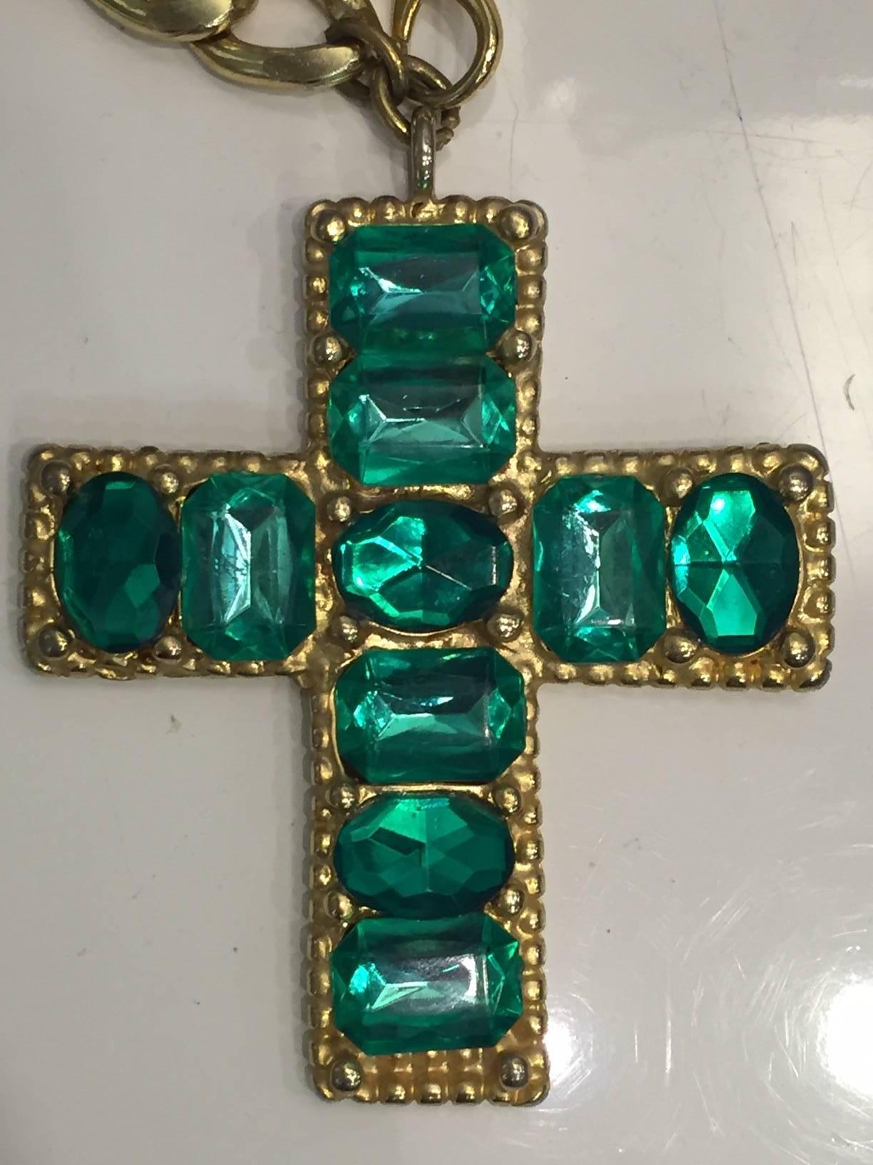 1980s Chunky emerald green resin jeweled cross in gold-tone setting and chain. Lobster-claw closure at center front.  Cross pendant is 4