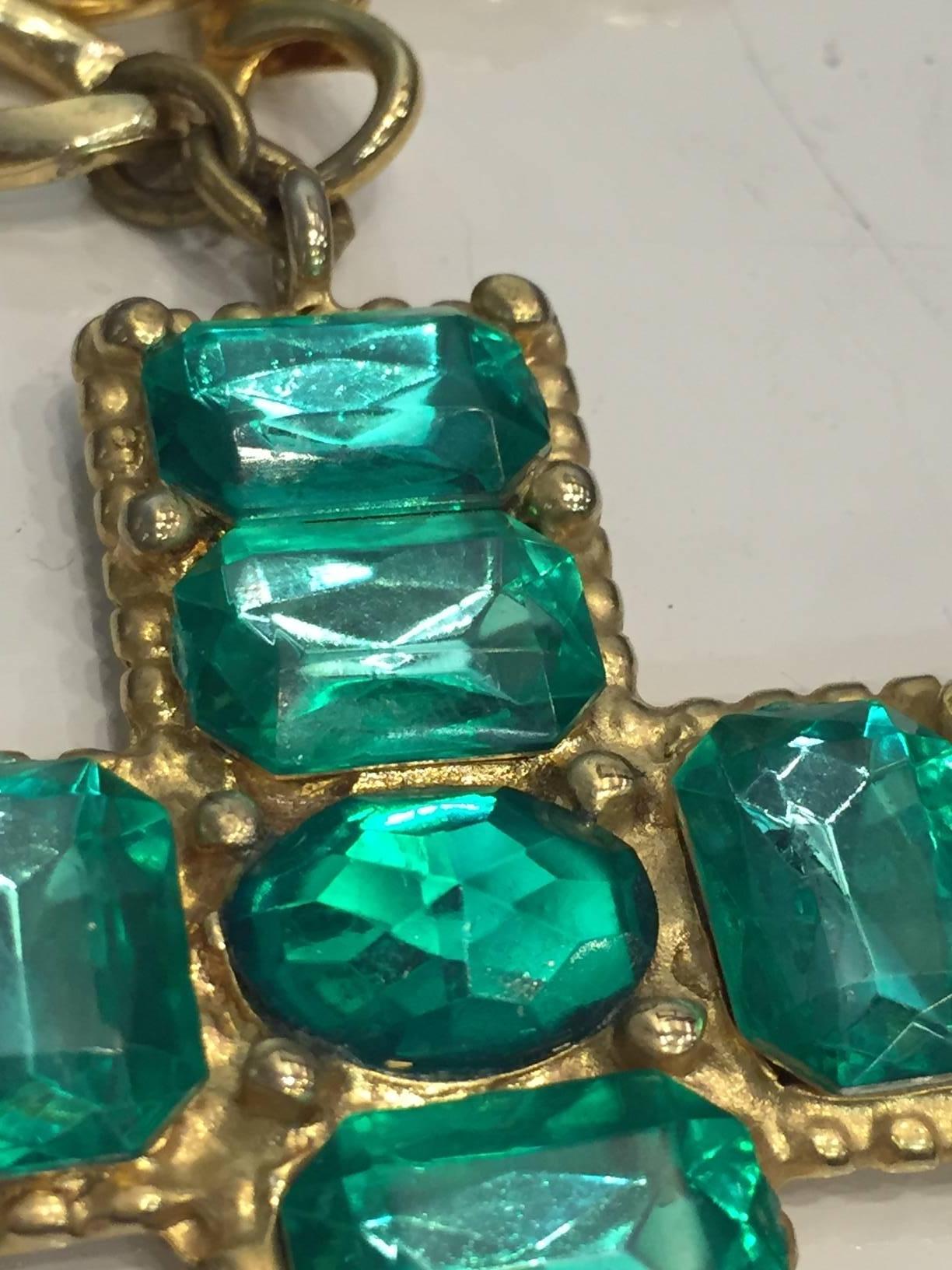 Women's or Men's 1980s Chunky Emerald Green Jeweled Cross on Gold-Tone Chain. 