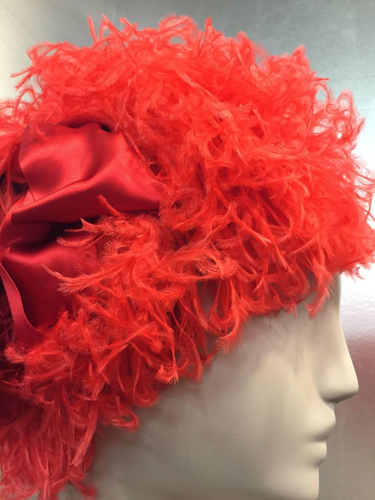 1960s Trésor structured coral red curled ostrich feather cocktail hat with charming red satin side bow  Can't do a thing with your hair?  Voila! This will take care of it. 
