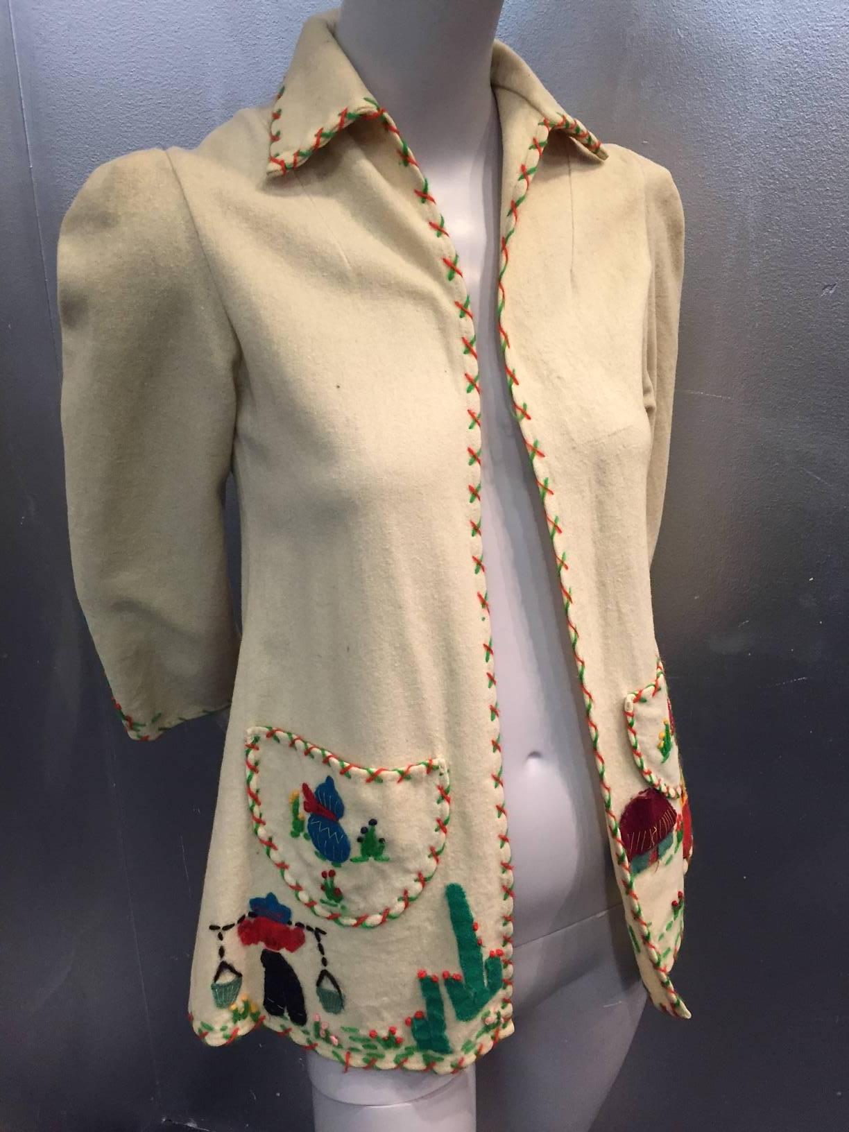 1940s wool felt Mexico souvenir jacket with elaborate applique in felt of dancing couple on back and cactus and figures on front and patch pockets. No closure. 