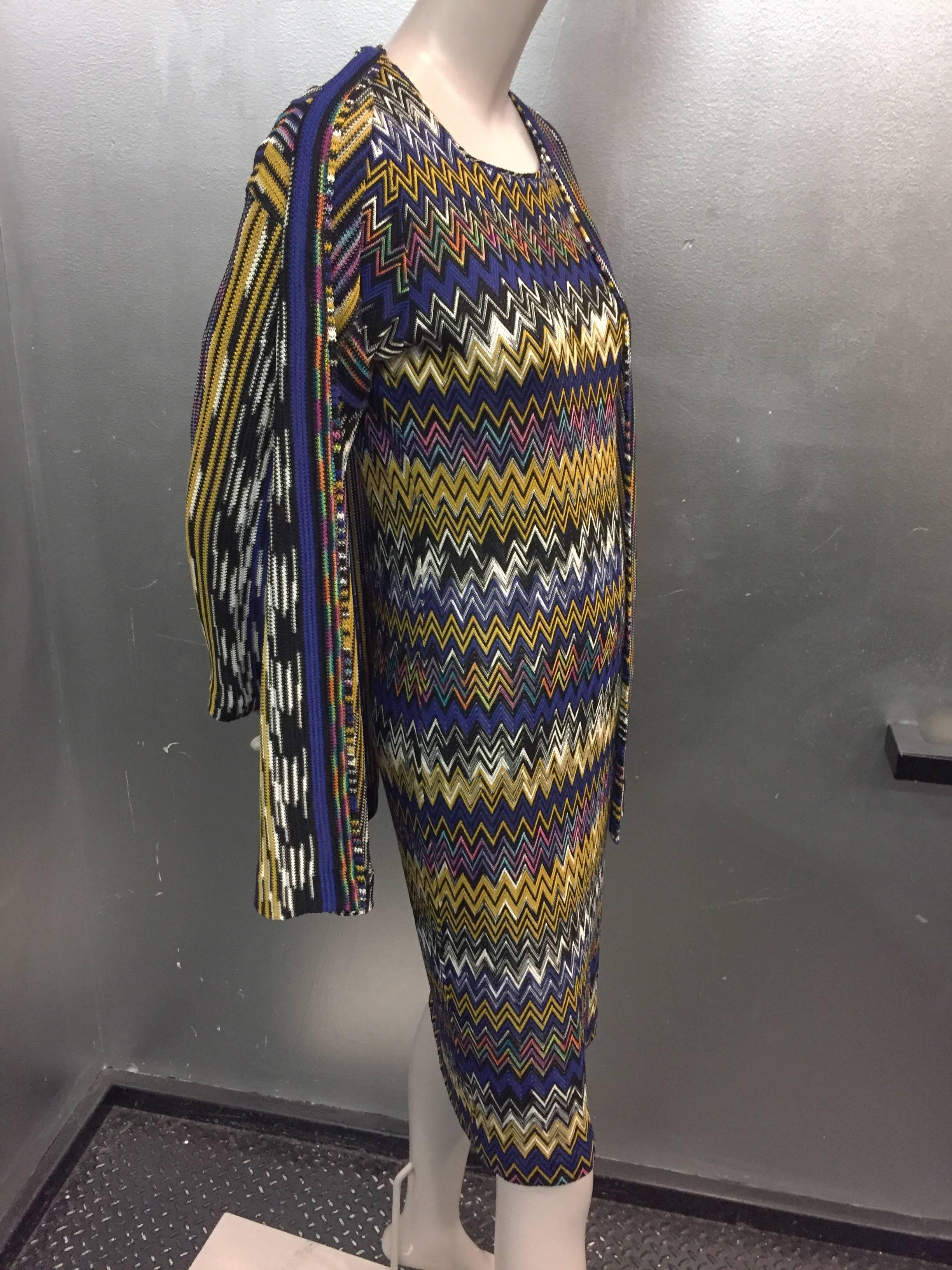 A gorgeous 1990s Missoni rayon and cotton chevron knit short sleeved dress and cardigan.  Shades of royal blue, black, white, gold, and several other colors make a versatile palette. Unlined. 