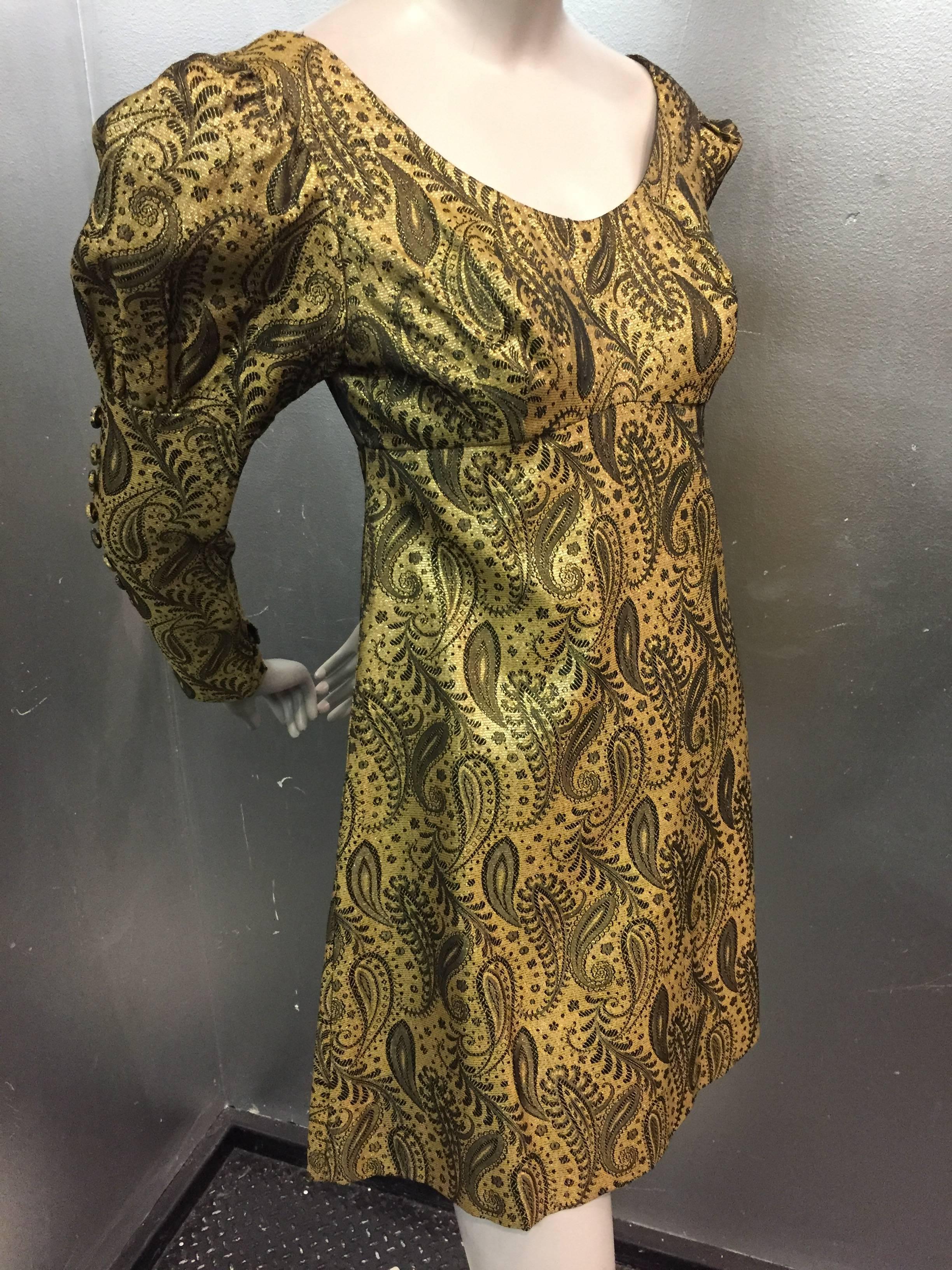 1960s Stella Roma brocade mini dress with fitted faux button up sleeves ending in a large leg o'mutton sleeve at shoulder. 