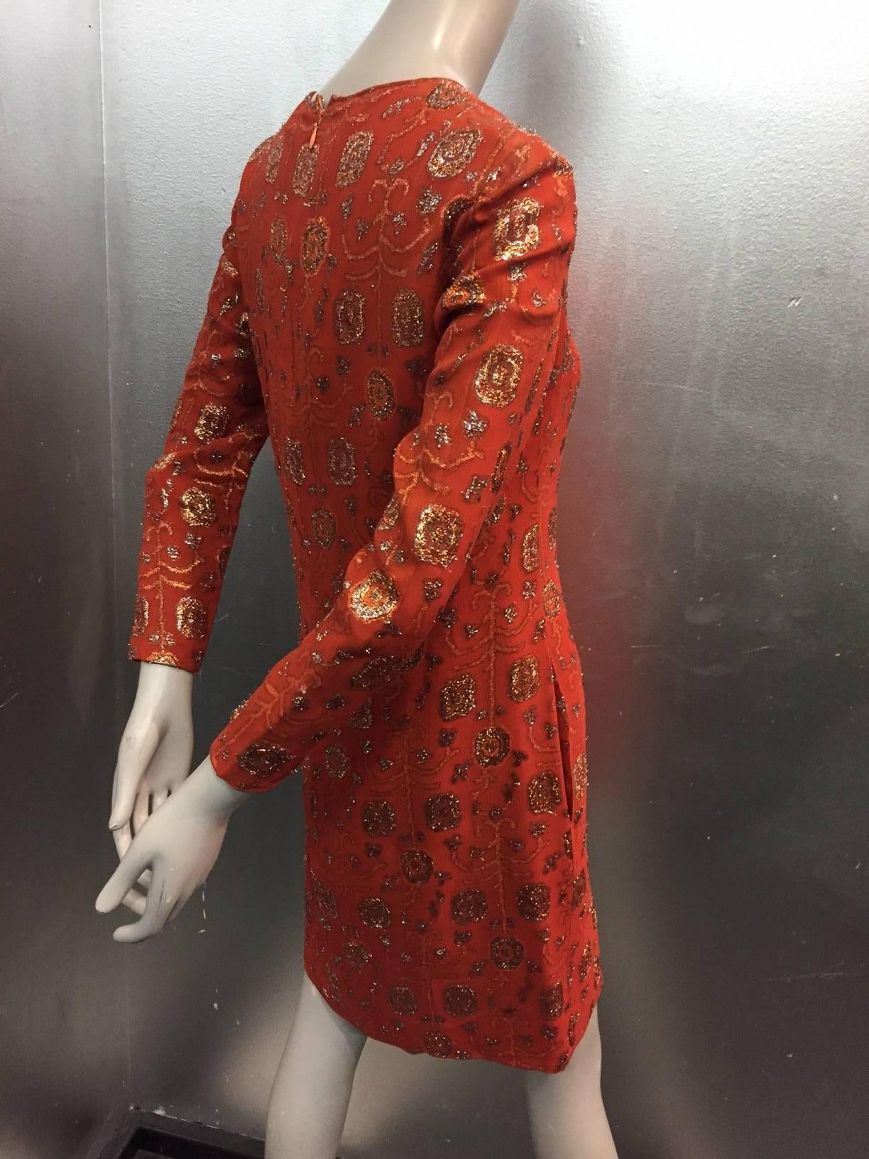 A beautiful 1960s I. Magnin burnt orange silk lamé brocade shift dress. Fully lined with side slit pockets