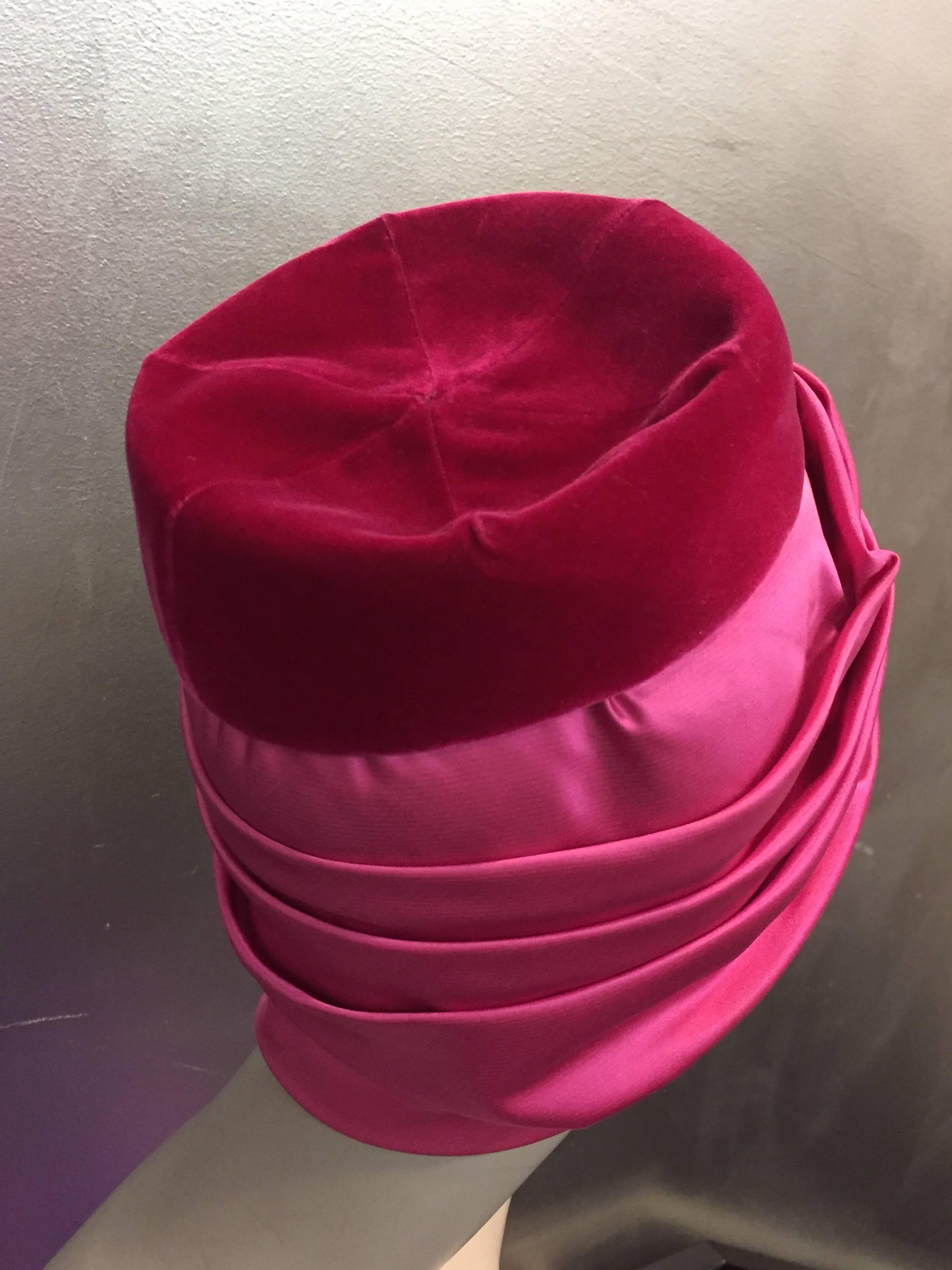 A fabulous 1960s Mr. Arnold turban styled hat:  Fuchsia silk satin and raspberry velvet. 