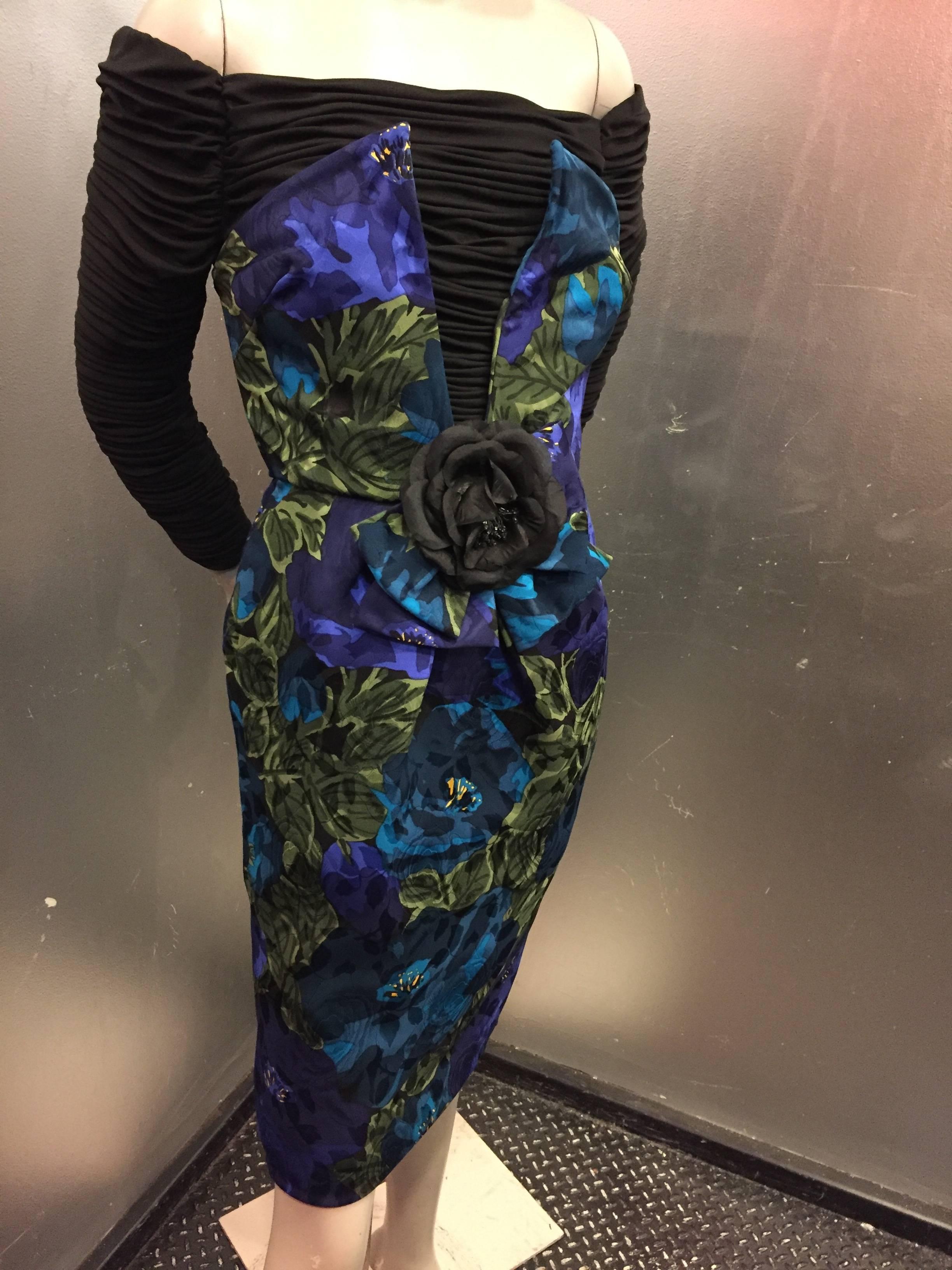 An unusual and sensational avant garde 1980s Loubé cocktail dress that features a gorgeous jewel-tone floral print crepe sheath dress with a Trompe L'Oeil Strapless silhouette, attached to a black ruched jersey off-the-shoulder neckline.  Heavily