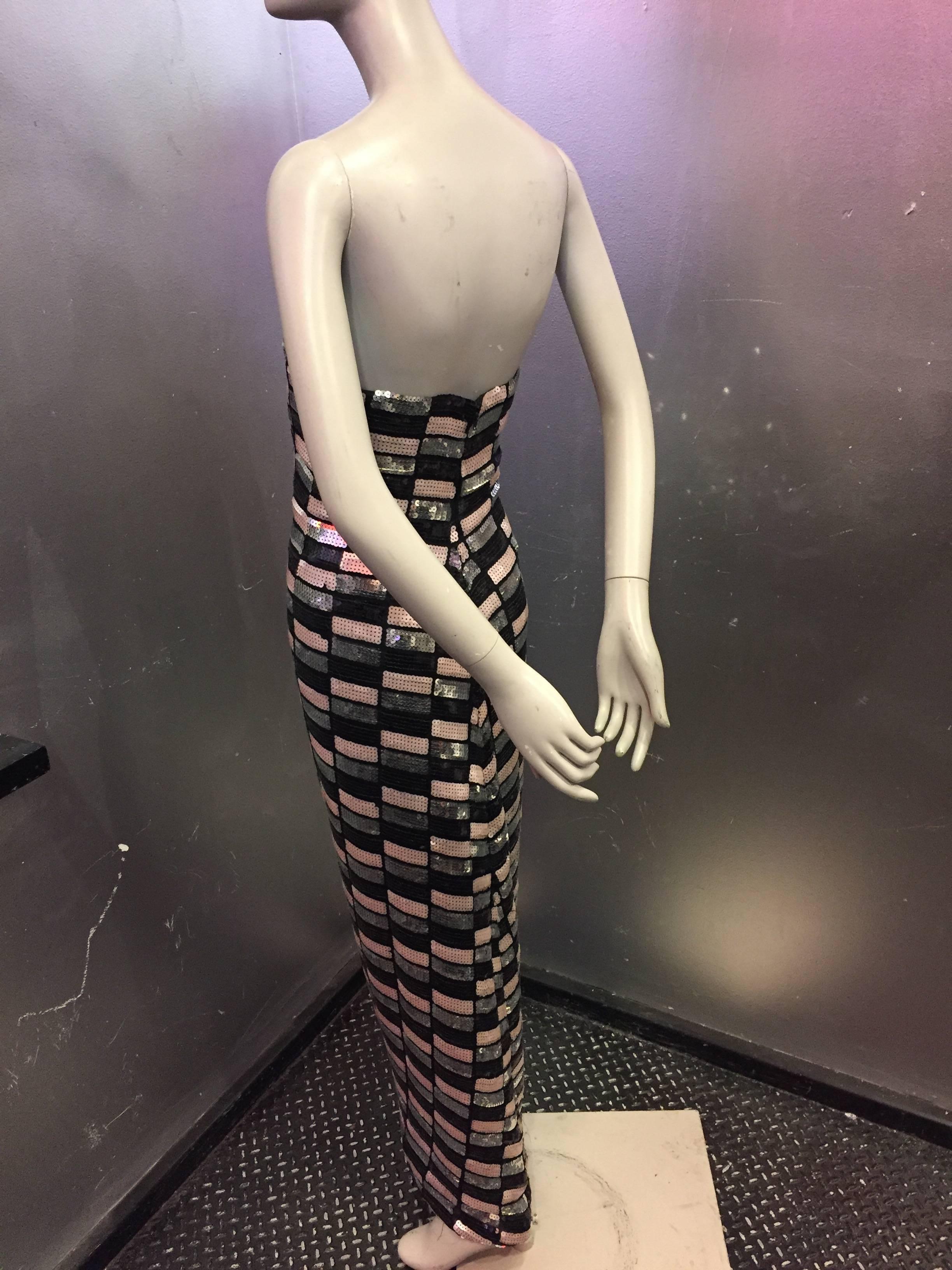 1970s Arnold Scaasi geometric patterned, pink, silver and black sequined strapless column gown with inset flared back in skirt. 