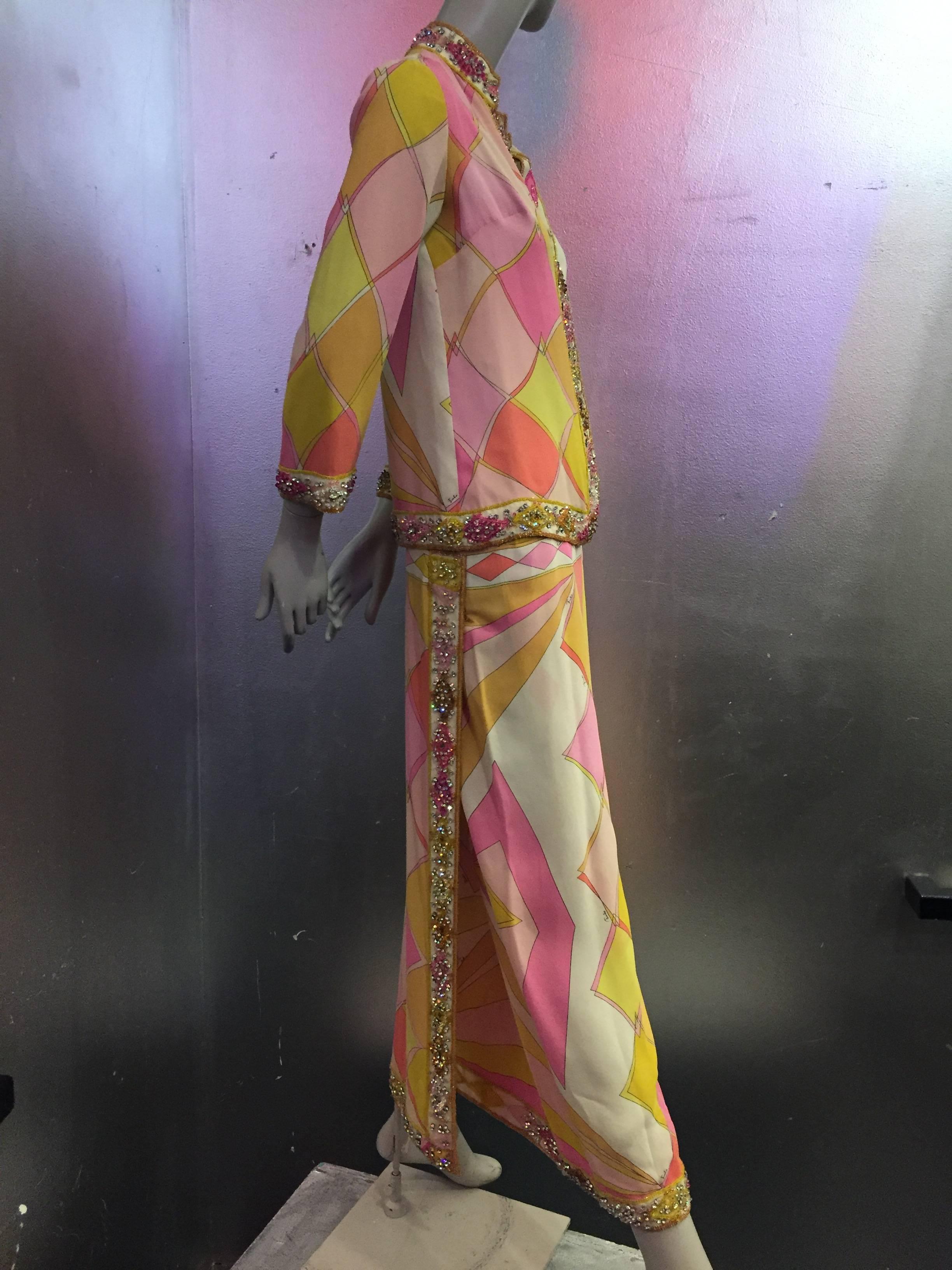 A gorgeous and rare 1960s Emilio Pucci coral, yellow, pink and white two-piece silk evening ensemble for resort or summer with maxi skirt and cardigan 3/4 sleeve style top.  Cardigan neckline, hem and cuffs, as well as skirt hem are trimmed in