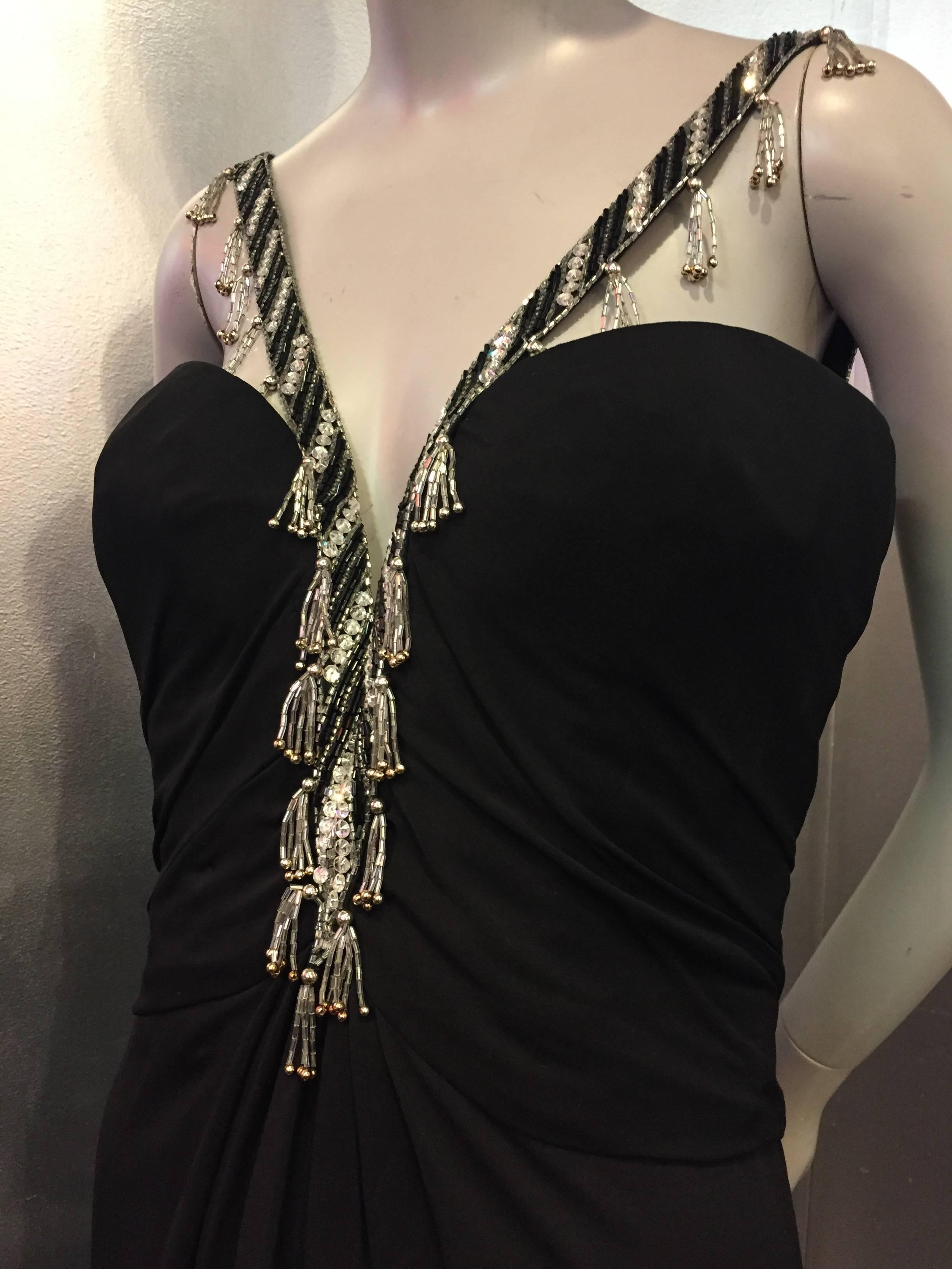 A gorgeous and sexy 1980s Bob Mackie classic black jersey gown with structured bodice and silver/black bead-tassel-fringed dramatic, plunging 